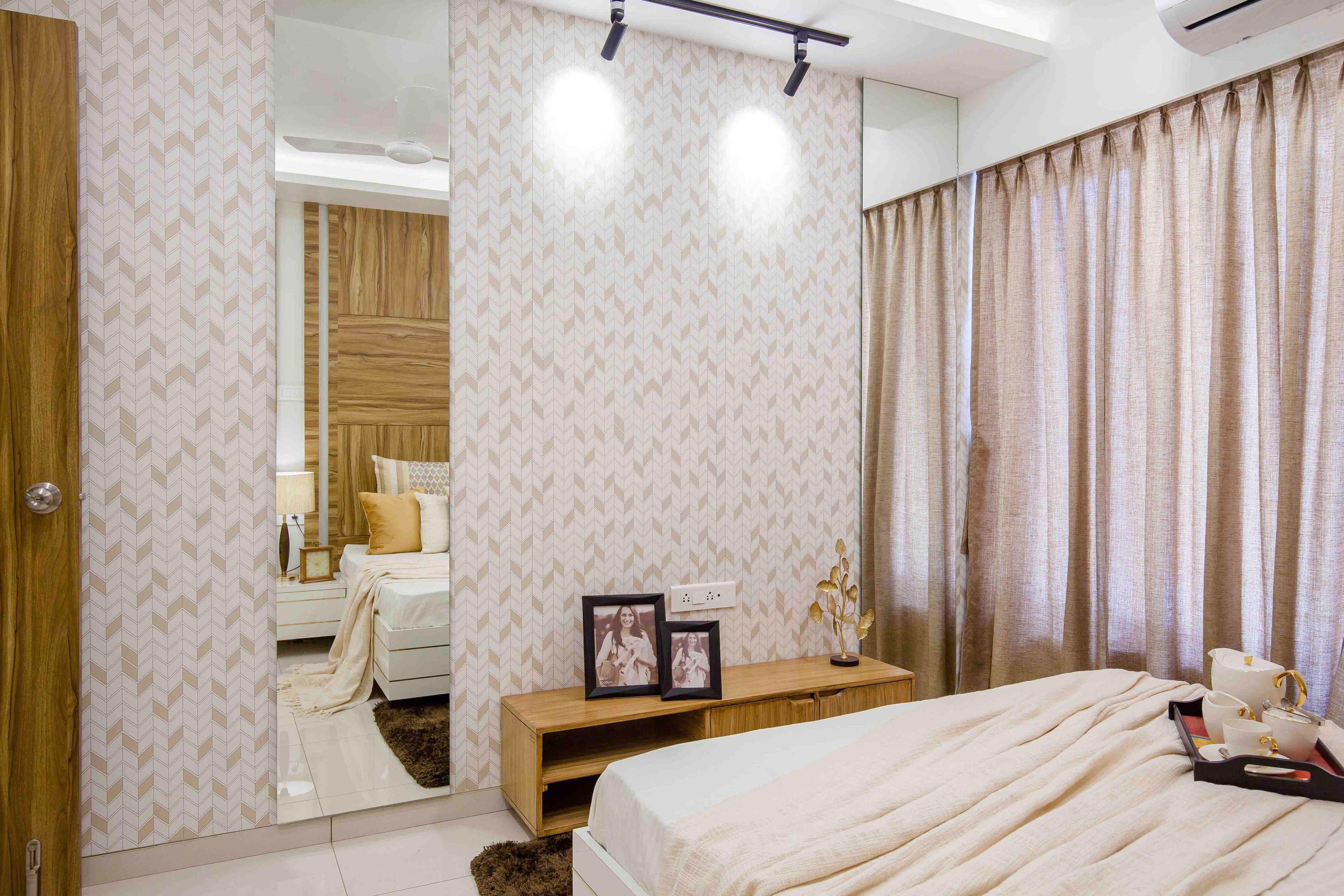 Master Bedroom With Chevron-Patterned Wall In White And Light Pink With Wall Mirror - Livspace