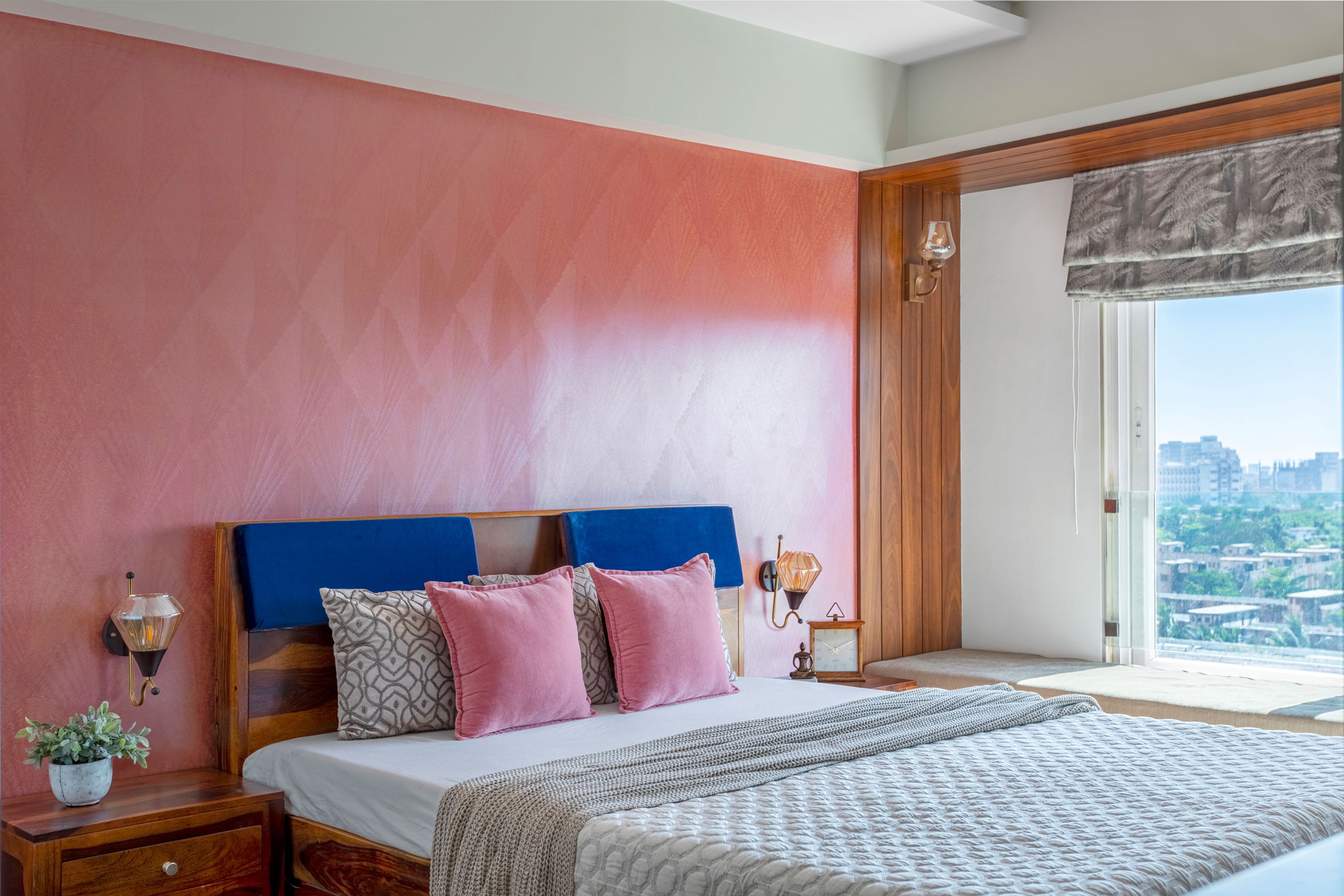 Master Bedroom Design With Pink Accent Wall And Wooden Bed - Livspace