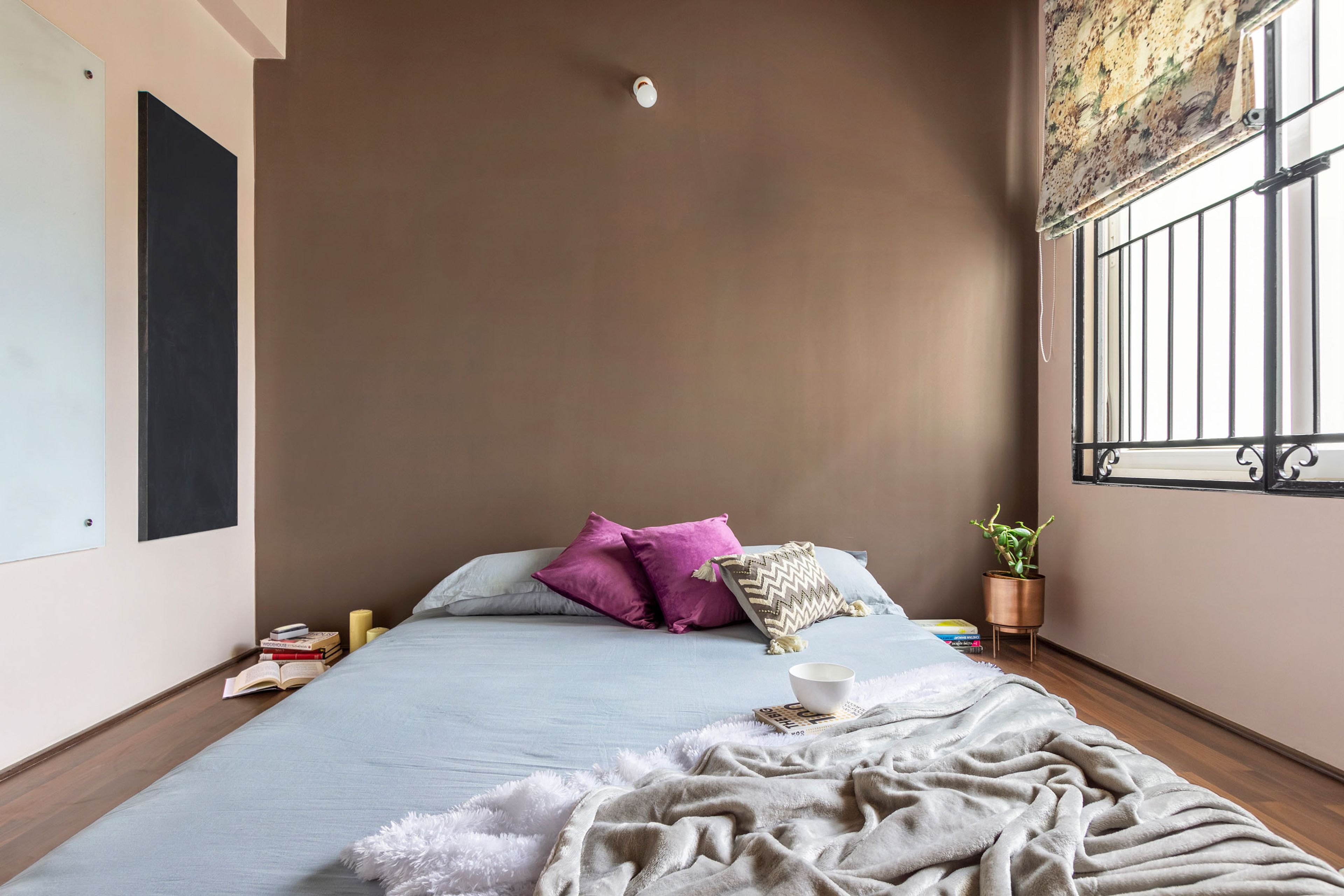 Brown And Pink Kids Room With Light Blue Floor Bed, Colourful Cushions - Livspace