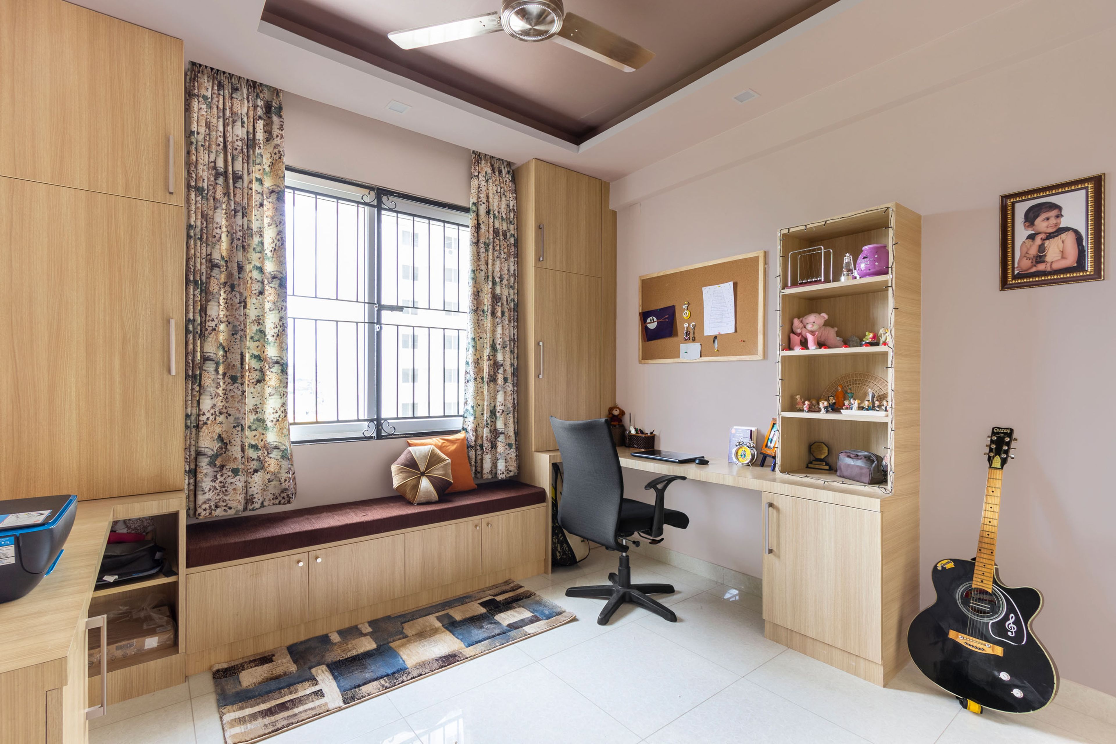 Home Office With Wooden Storage, Bay Seater And Wooden Study Table - Livspace