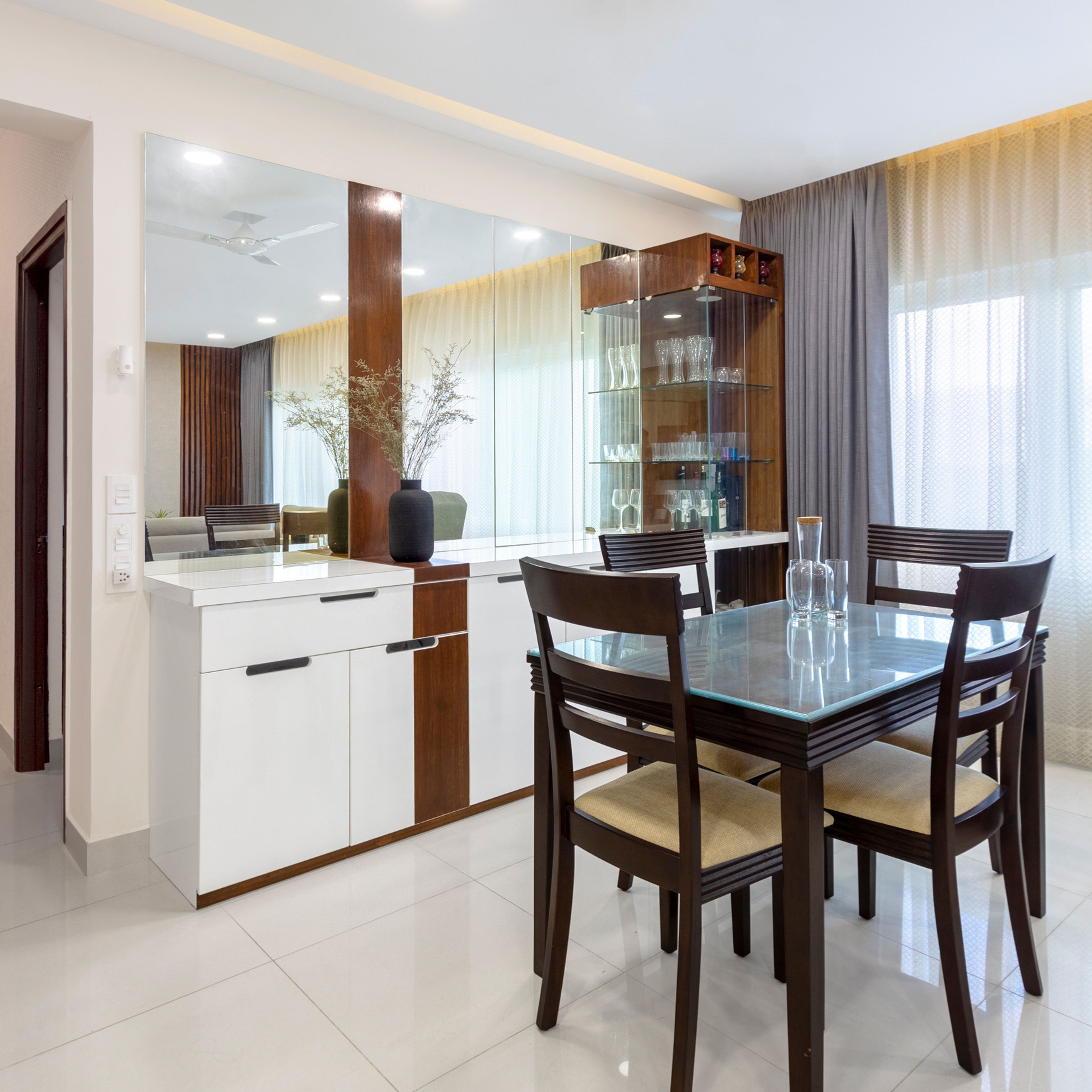 4-Seater Dining Room Design With White And Wood Storage Unit And Bar Unit - Livspace