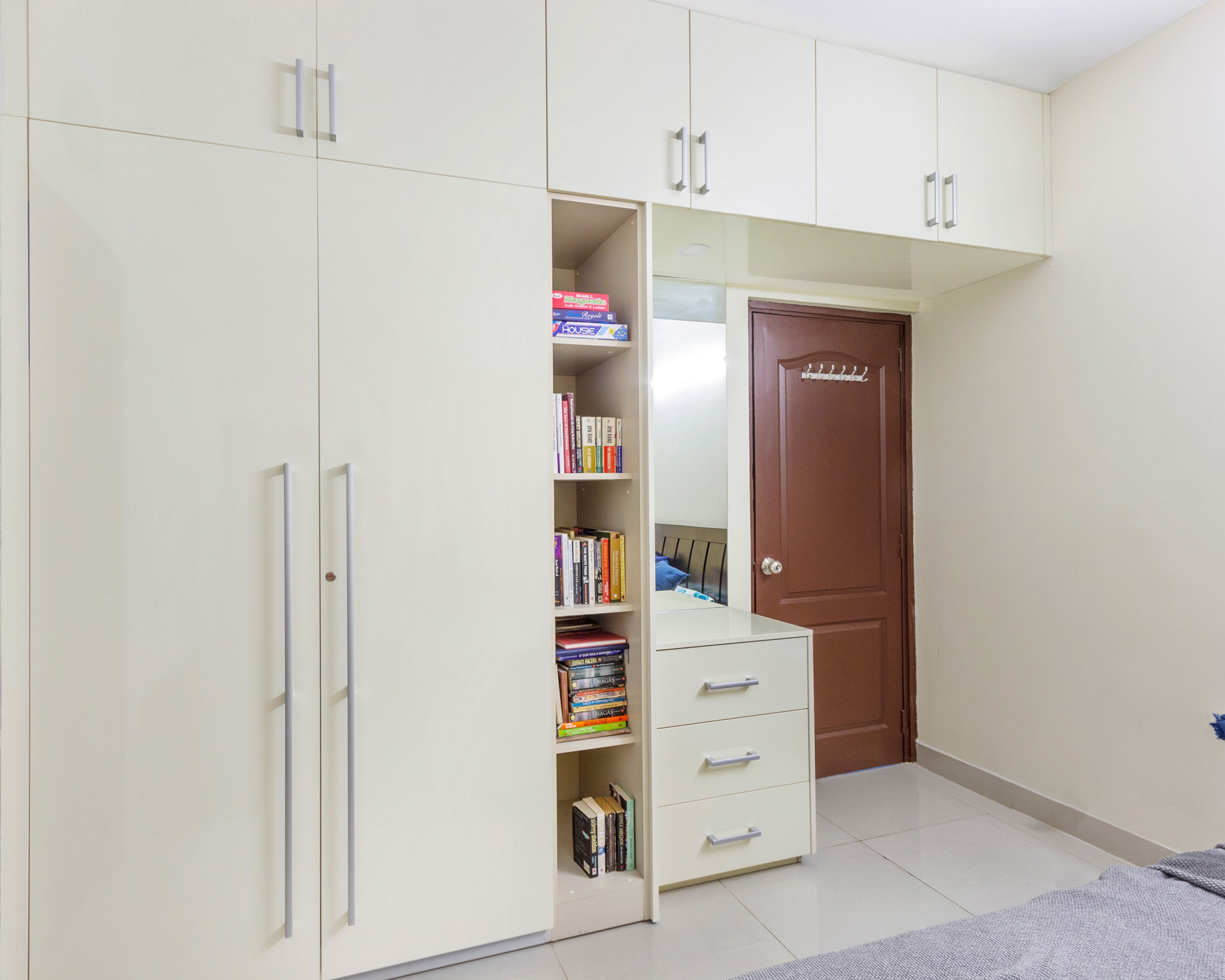 2-Door White Swing Wardrobe Design With Loft Storage For Master Bedroom - Livspace