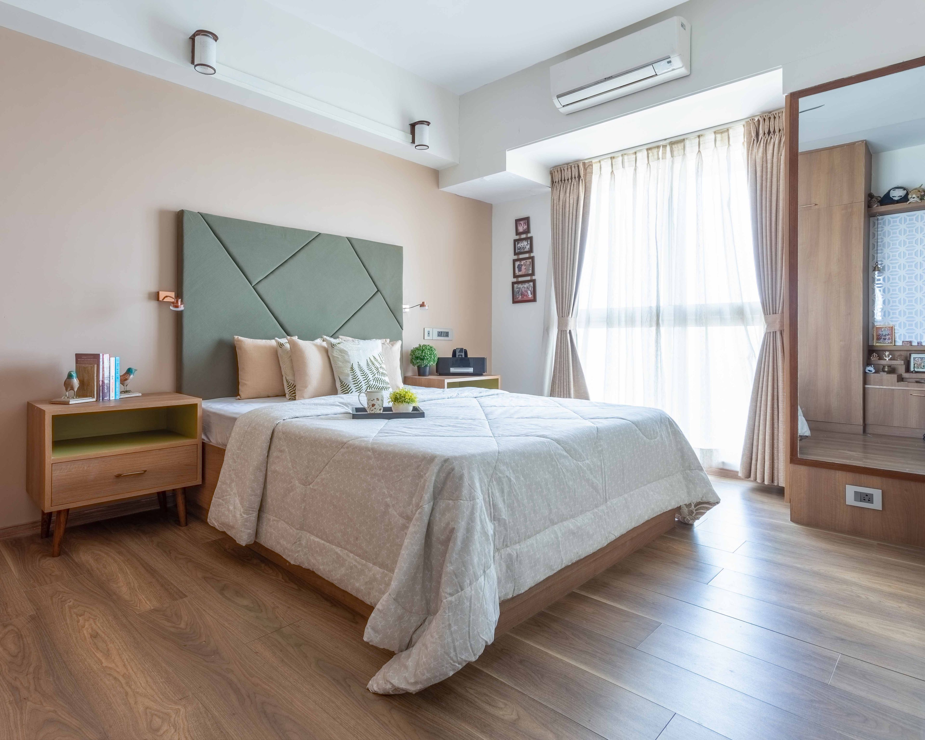 Beige And Green Guest Bedroom Design With Wooden Flooring - Livspace