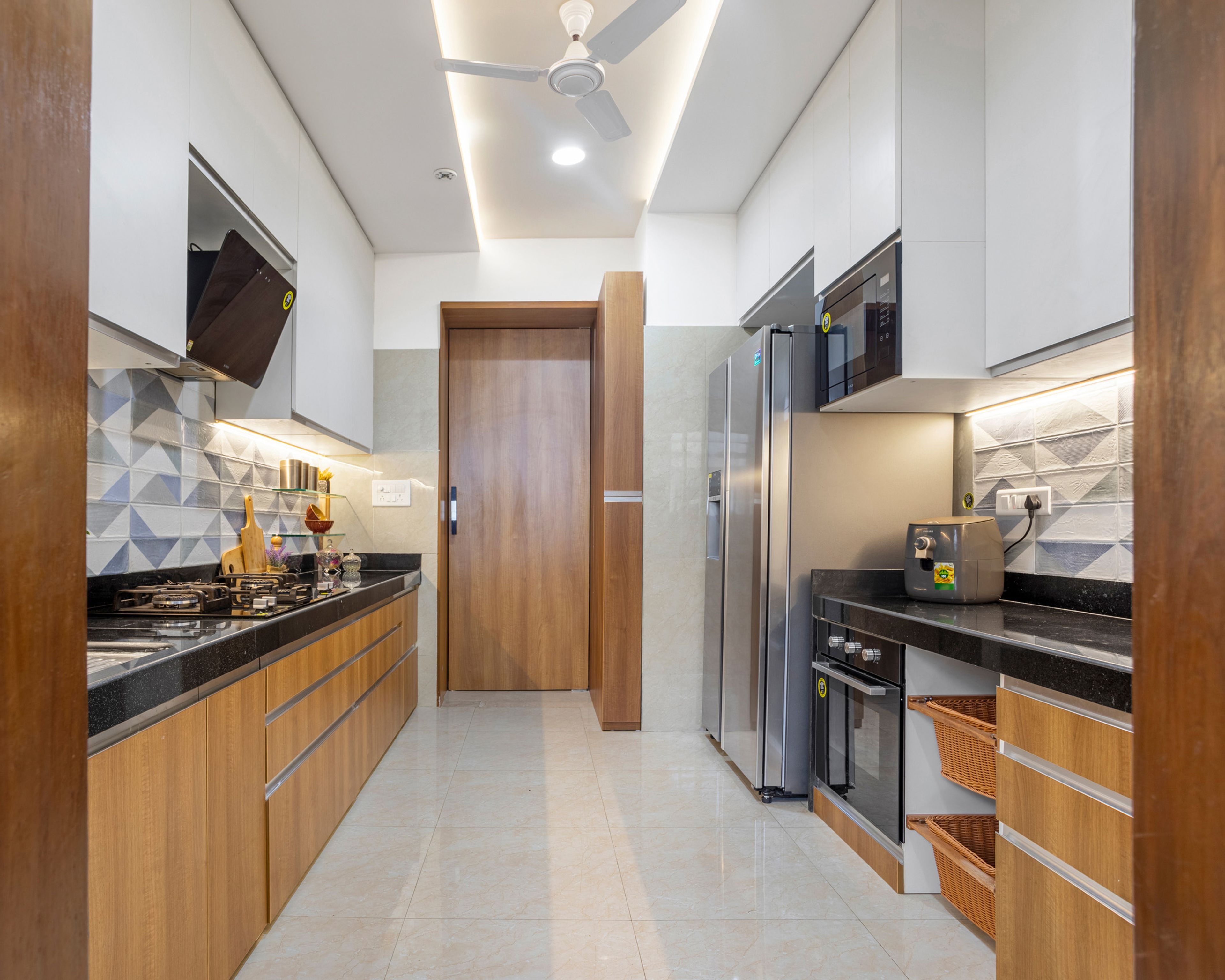 White And Wood Parallel Modular Kitchen With Geometric Backsplash - Livspace