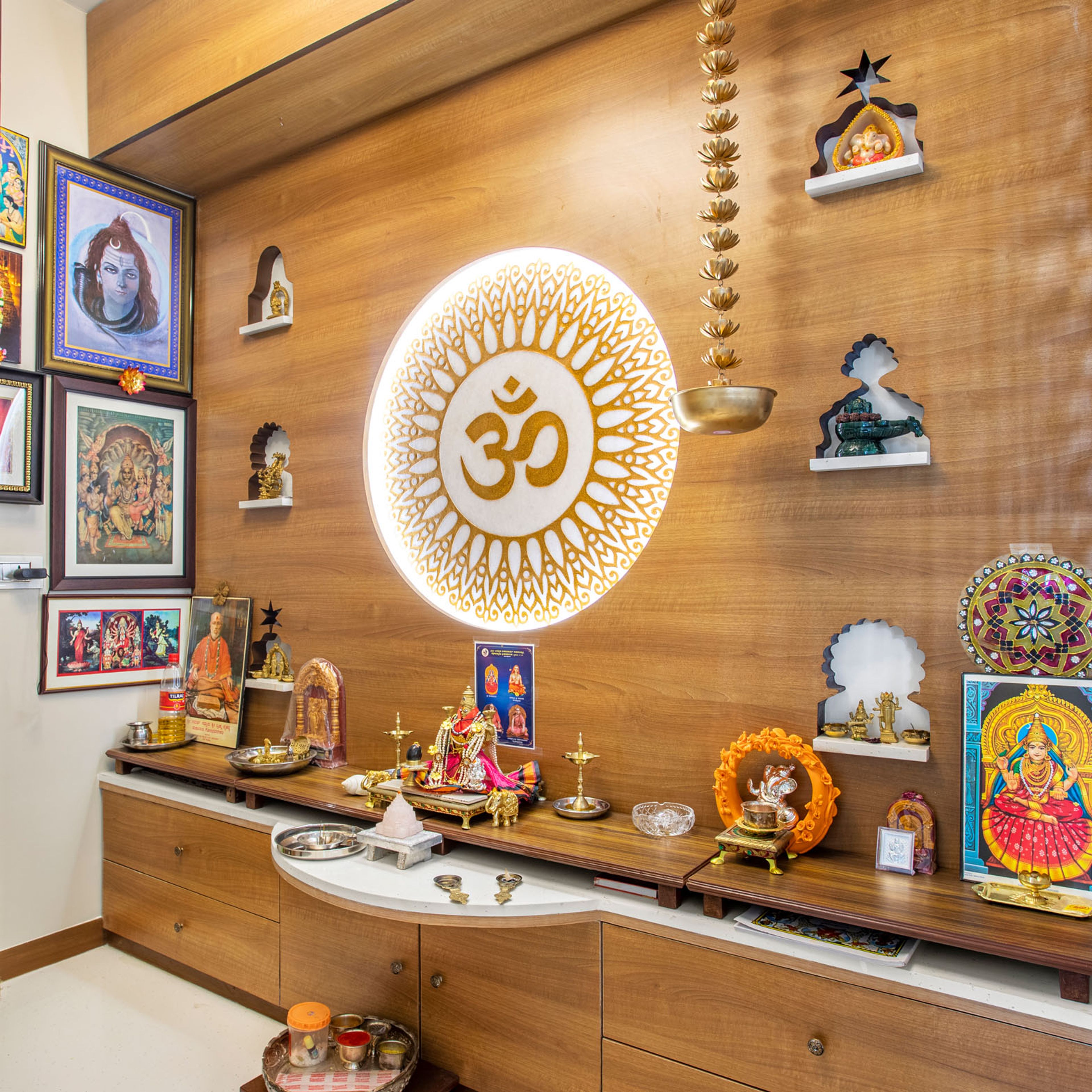 All-Wood Pooja Room Design With Carved Om Motif And Drawer Storage - Livspace