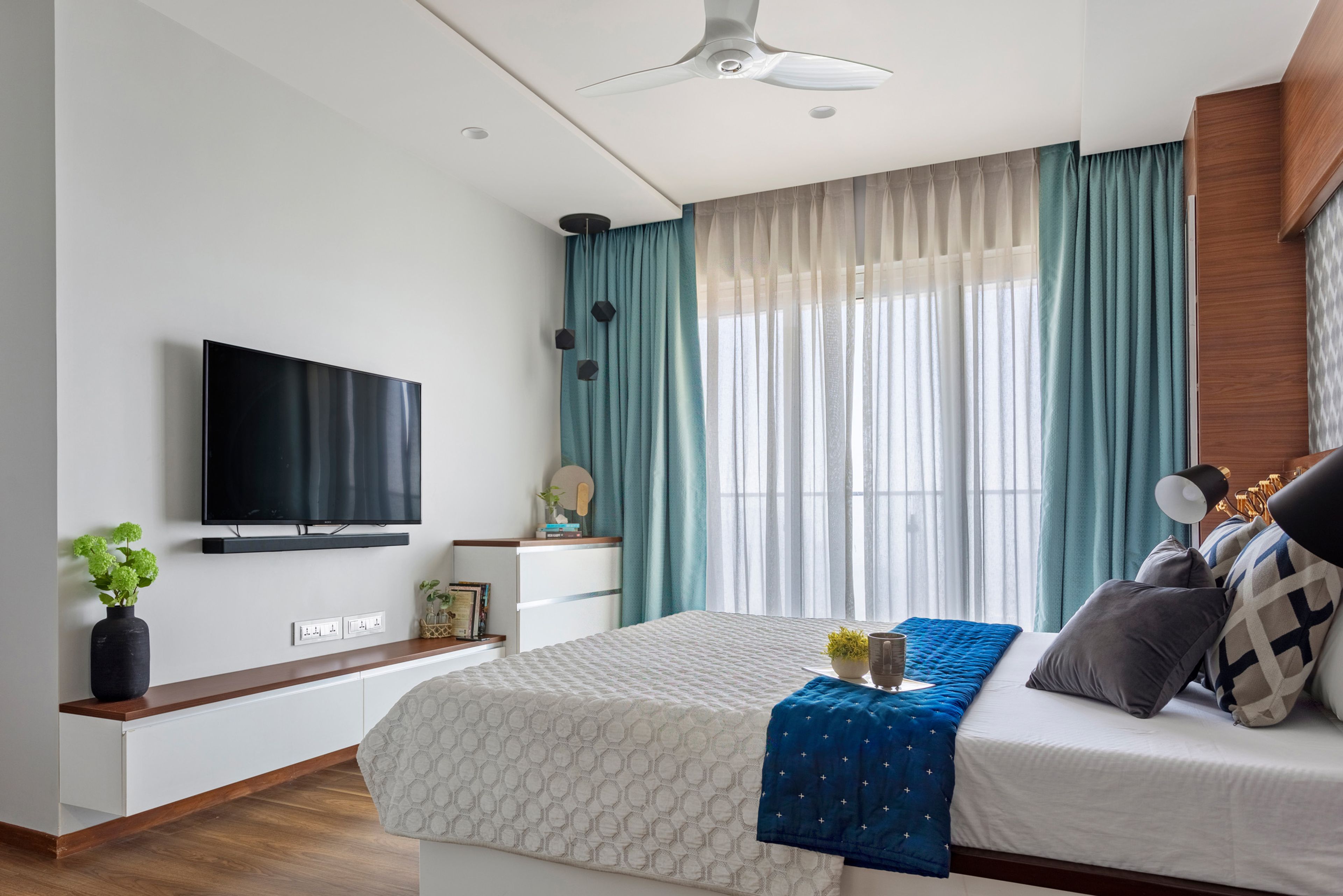 Wall-Mounted White And Wood TV Console For The Master Bedroom - Livspace