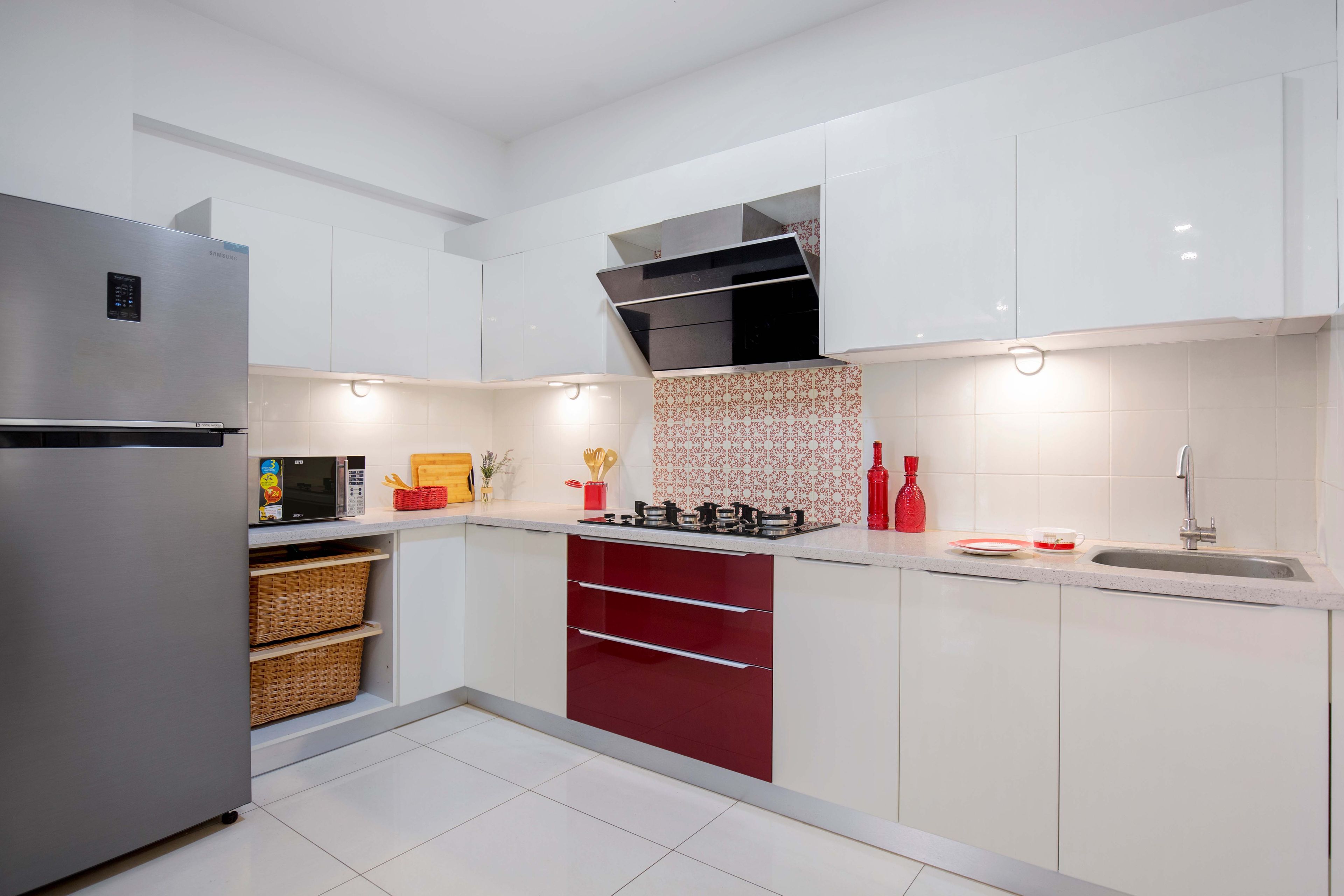 Contemporary Bangalore 2-BHK Flat Design With White And Red Glossy L-Shape Kitchen