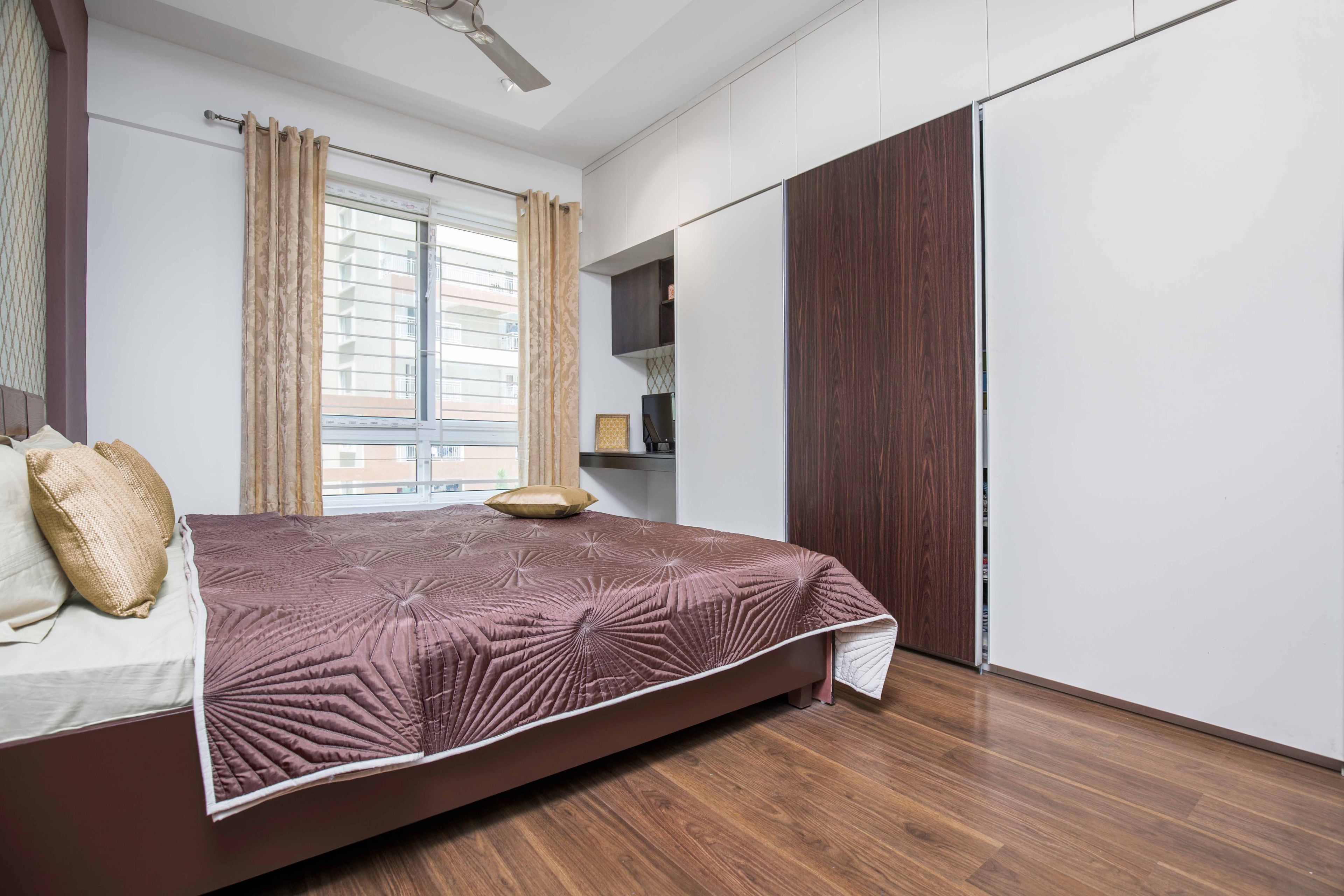Master Bedroom With 3-Door White And Wood Sliding Wardrobe - Livspace