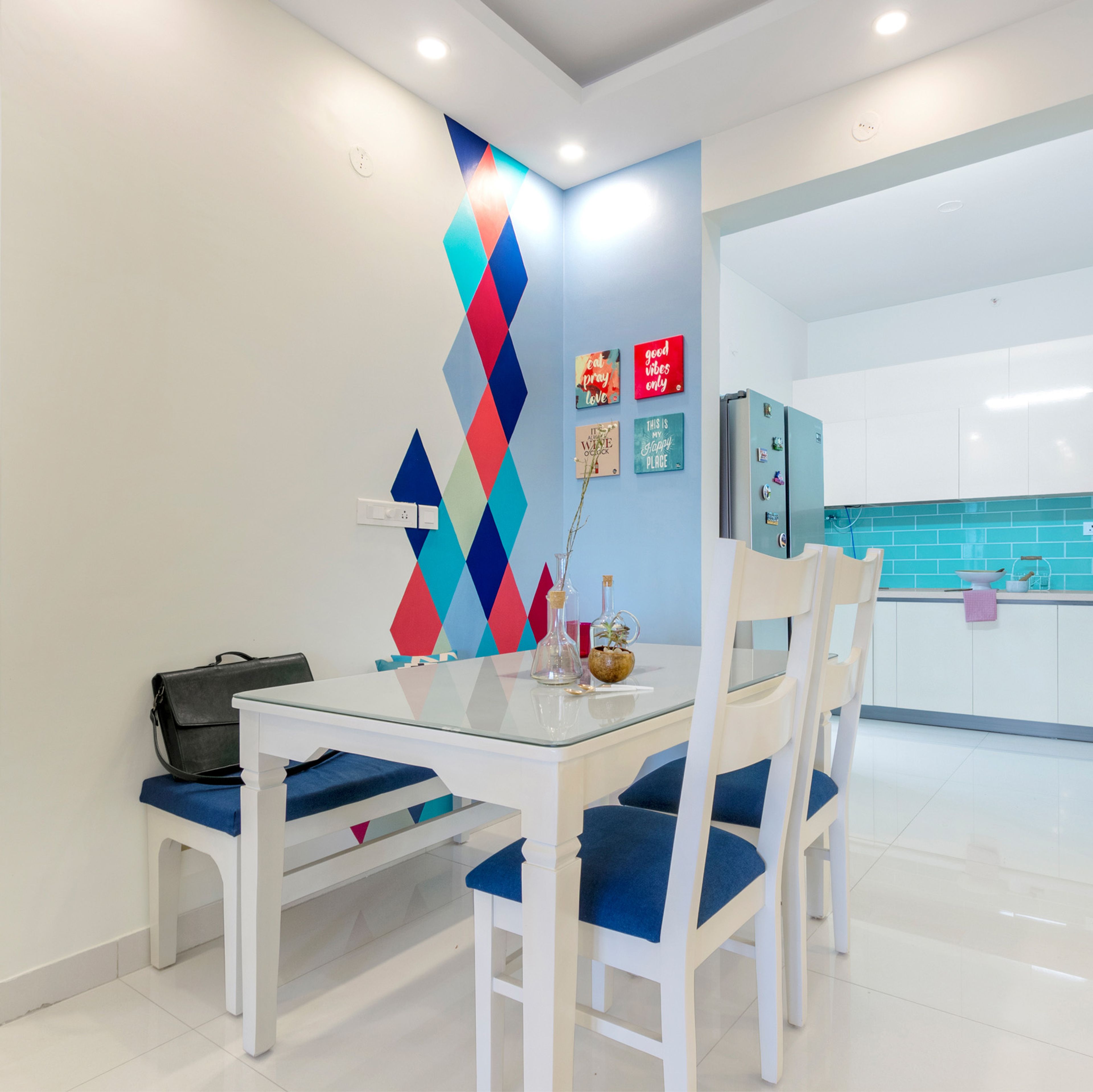 3-Seater White And Blue Dining Room Design With Geometric Multicoloured Wallpaper - Livspace