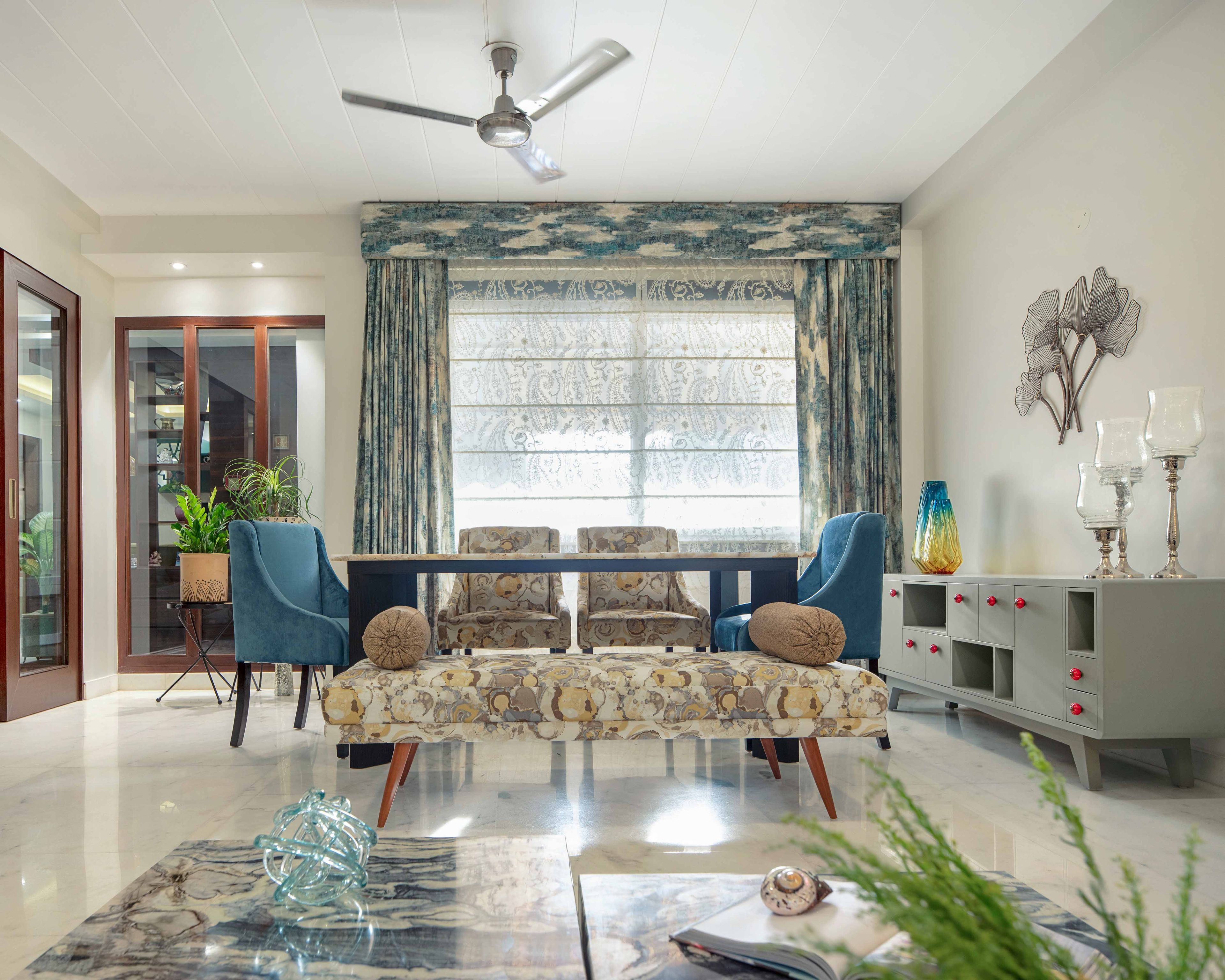 4-seater blue and patterned dining table design with patterned seater - Livspace