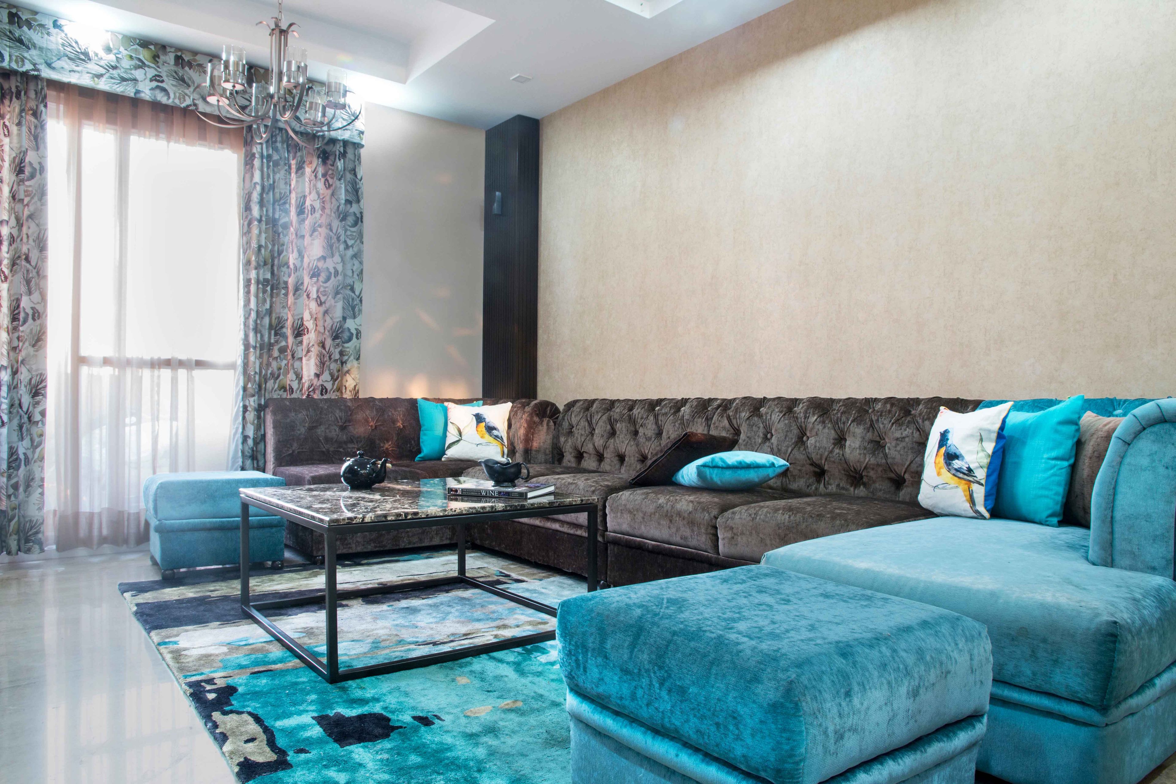 Spacious Dark Brown And Blue U-Shaped Living Room Design - Livspace