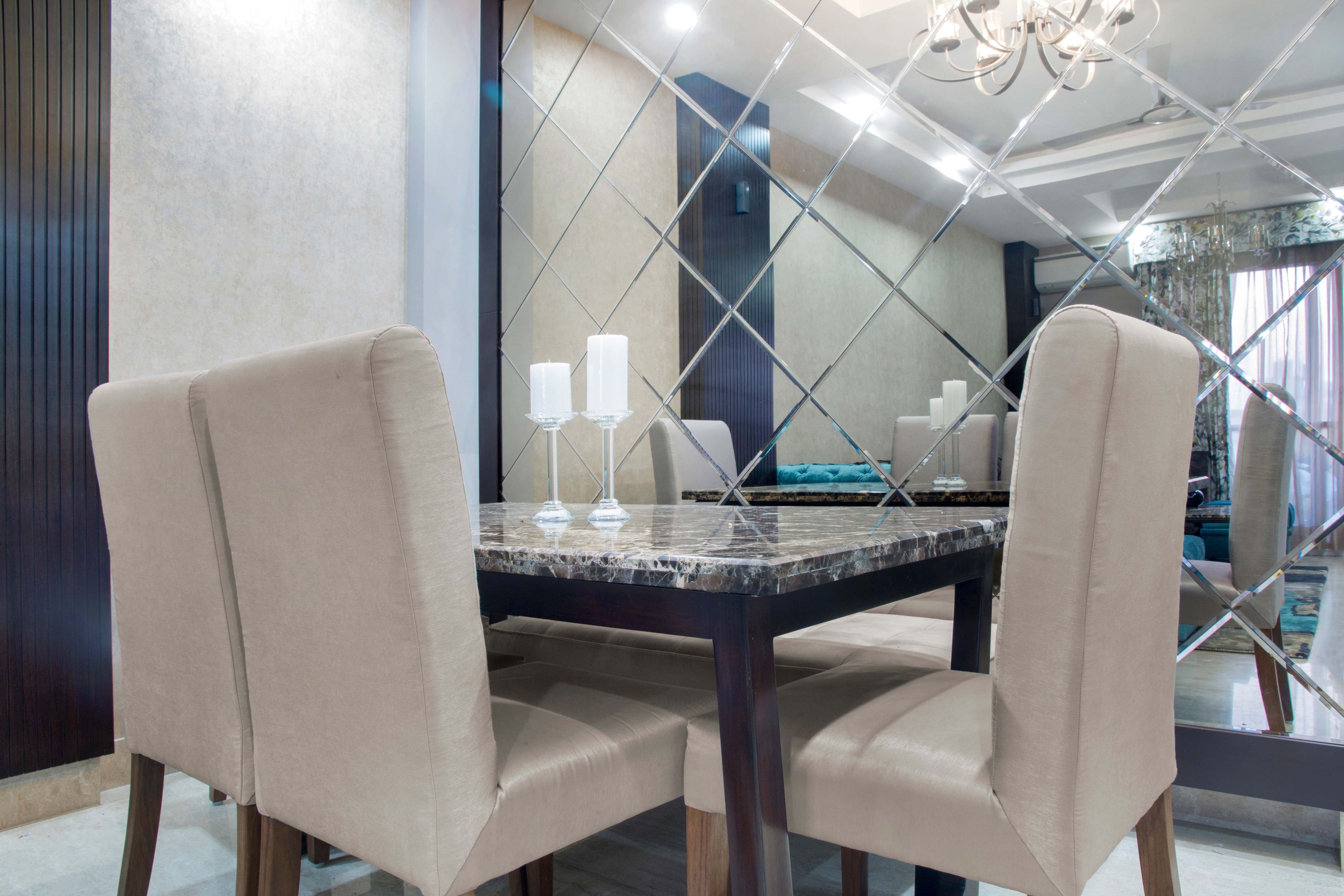4-Seater Beige And Black Dining Room Design With Granite Table And Bevelled Mirror Panel - Livspace