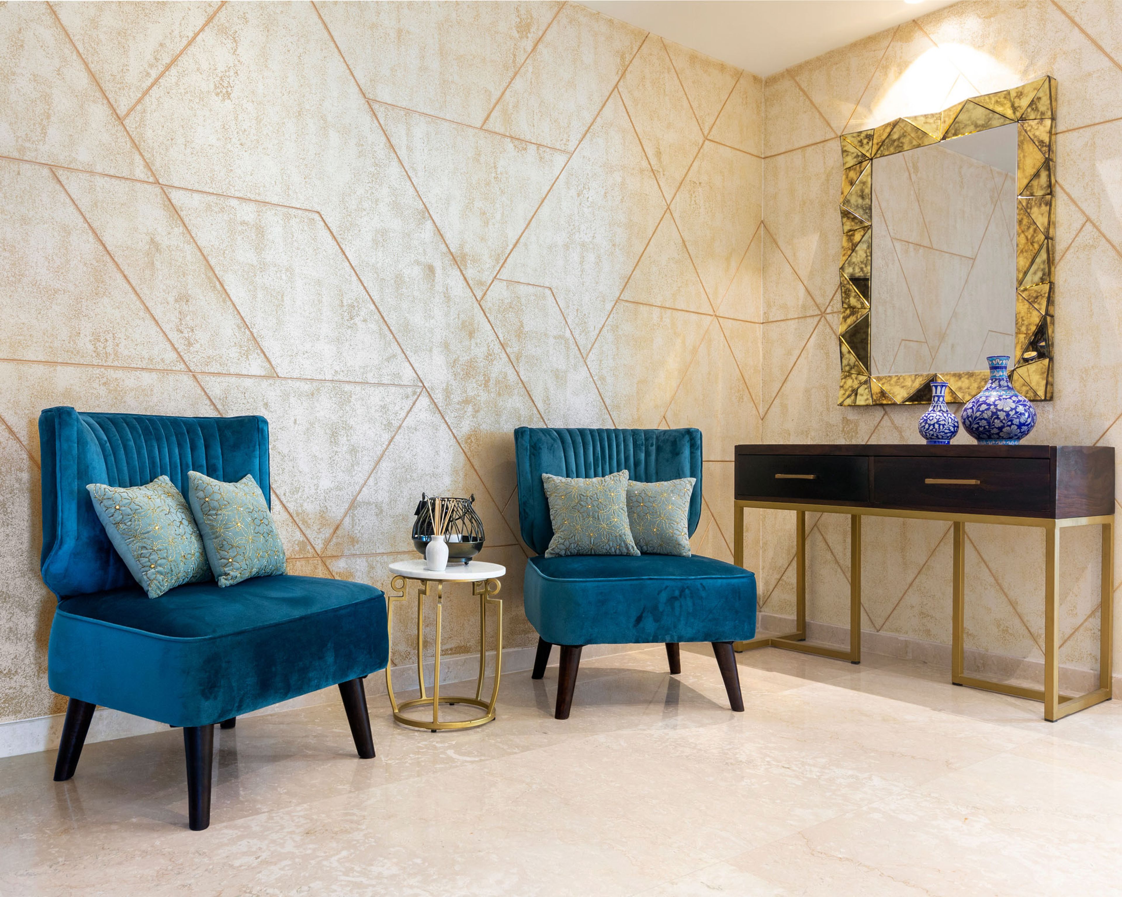 Foyer Design With Beige And Gold Wall, Blue Accent Chairs And Wooden Storage Unit With Mirror - Livspace