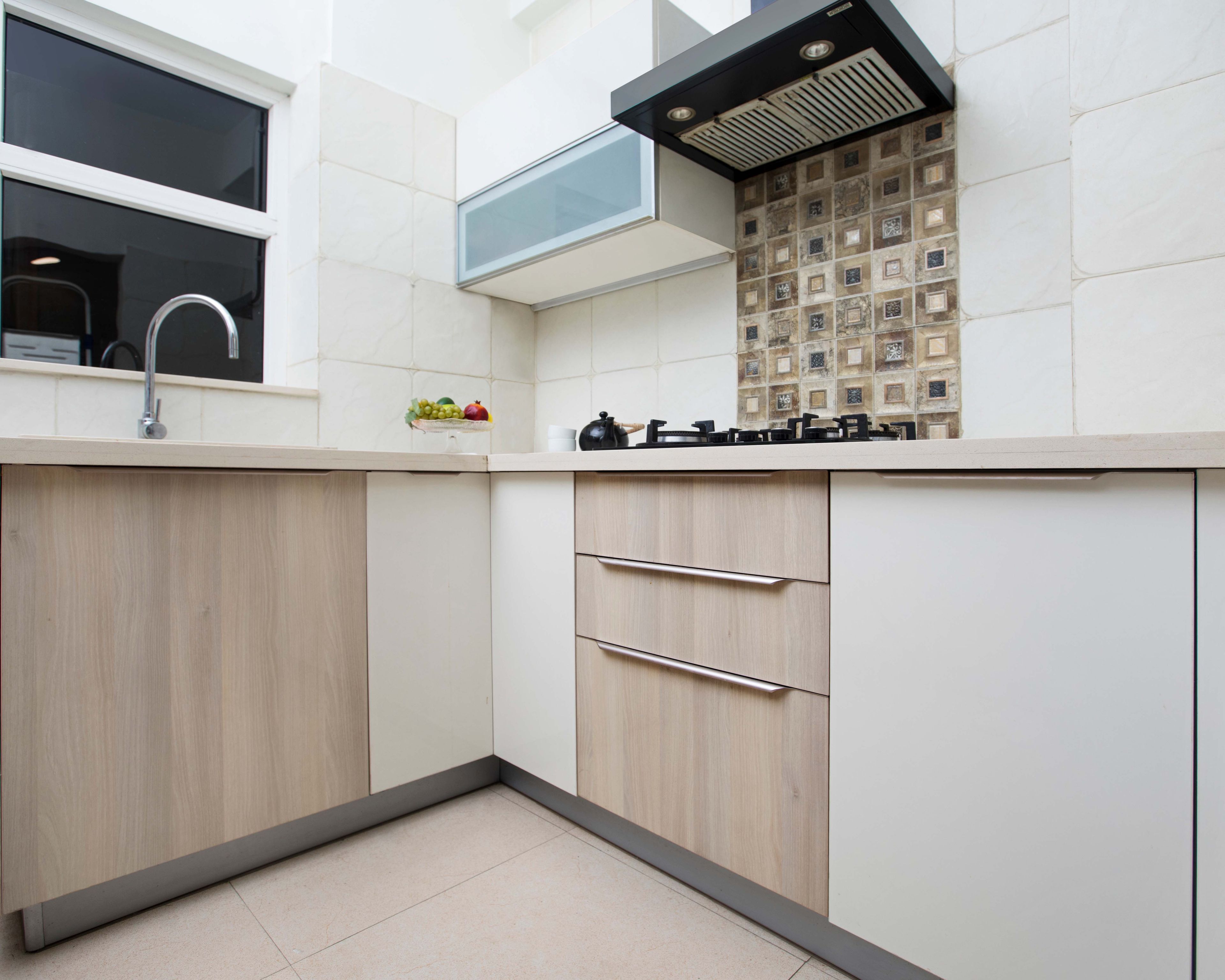 Contemporary 2 BHK Interior Design For Noida Flat With Wood And White L Shape Kitchen