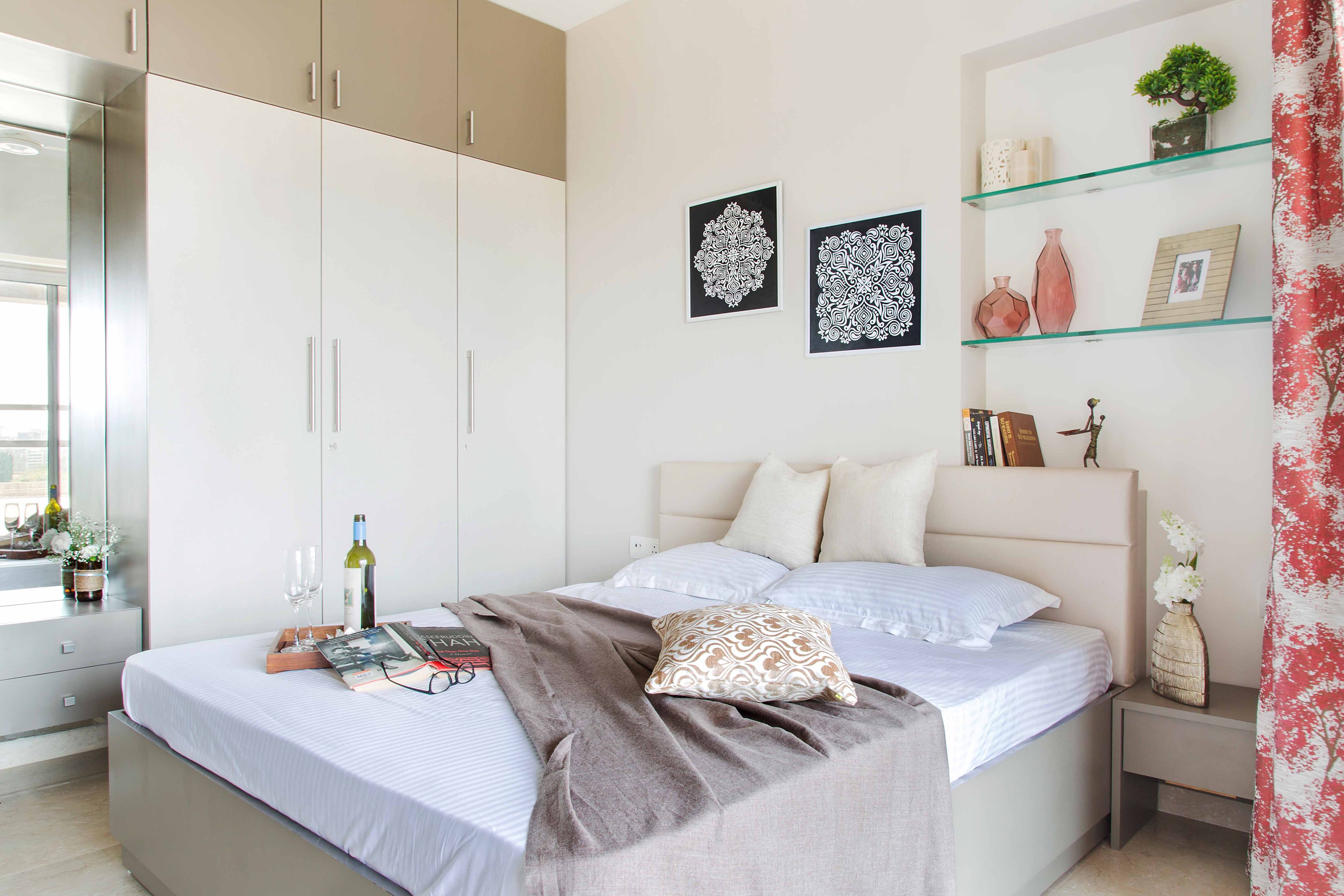 Guest Room With Off-White Queen-Size Bed And 6-Door White And Light Brown Swing Wardrobe - Livspace