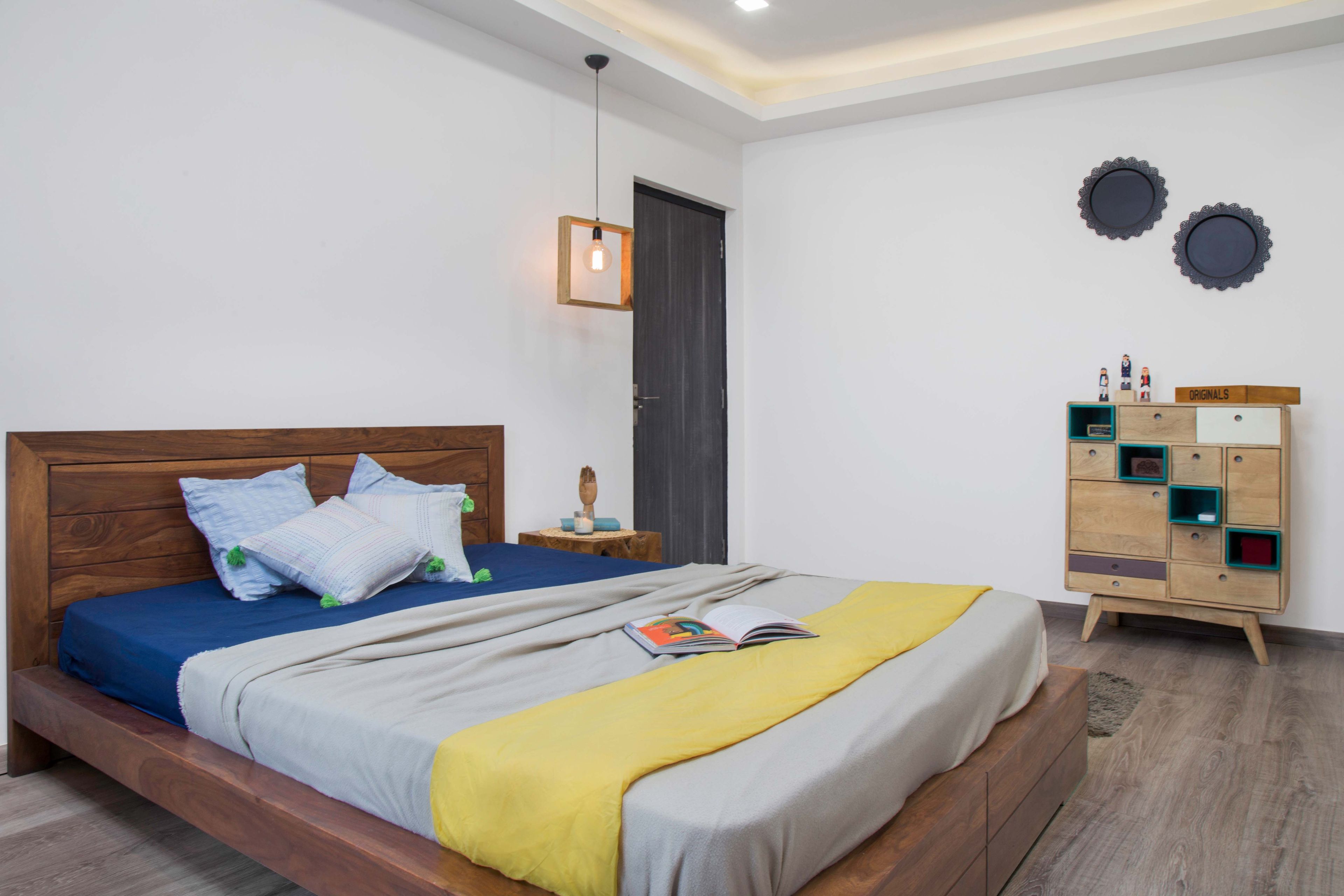 Guest Bedroom With Wooden Bed And Wooden Storage Unit - Livspace