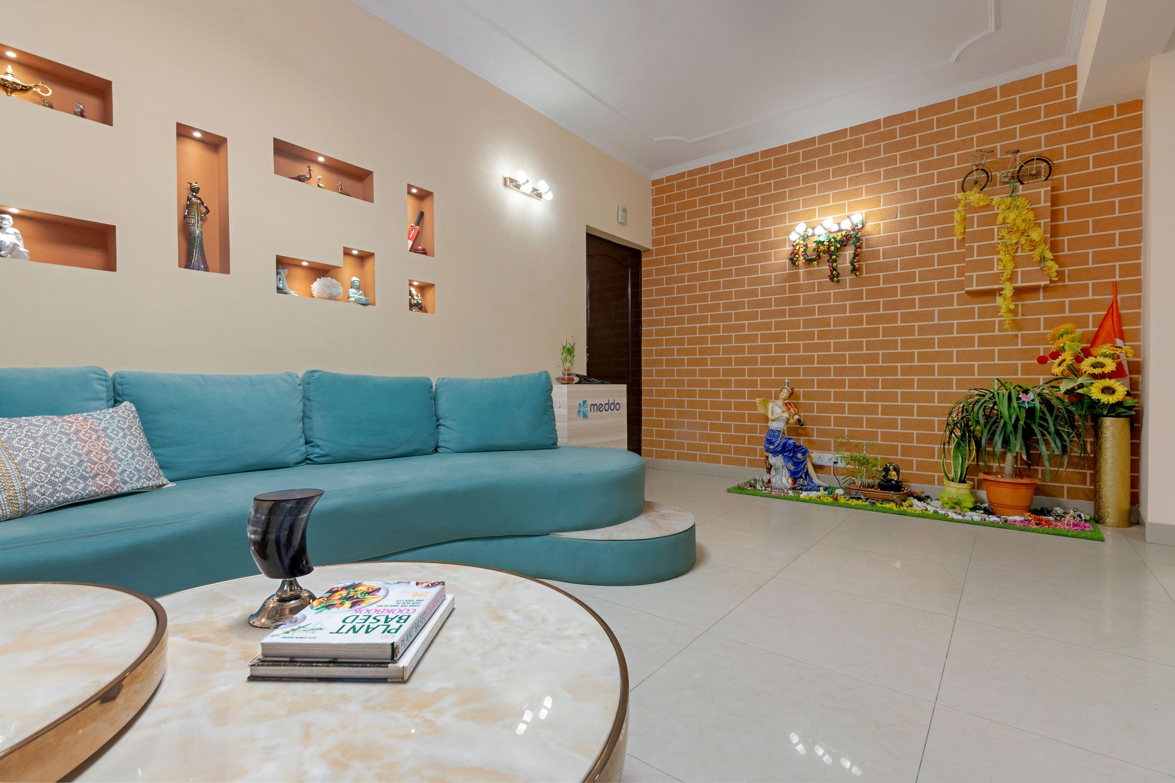 Foyer Design With Red Brick Wall And Open Living Room Layout - Livspace