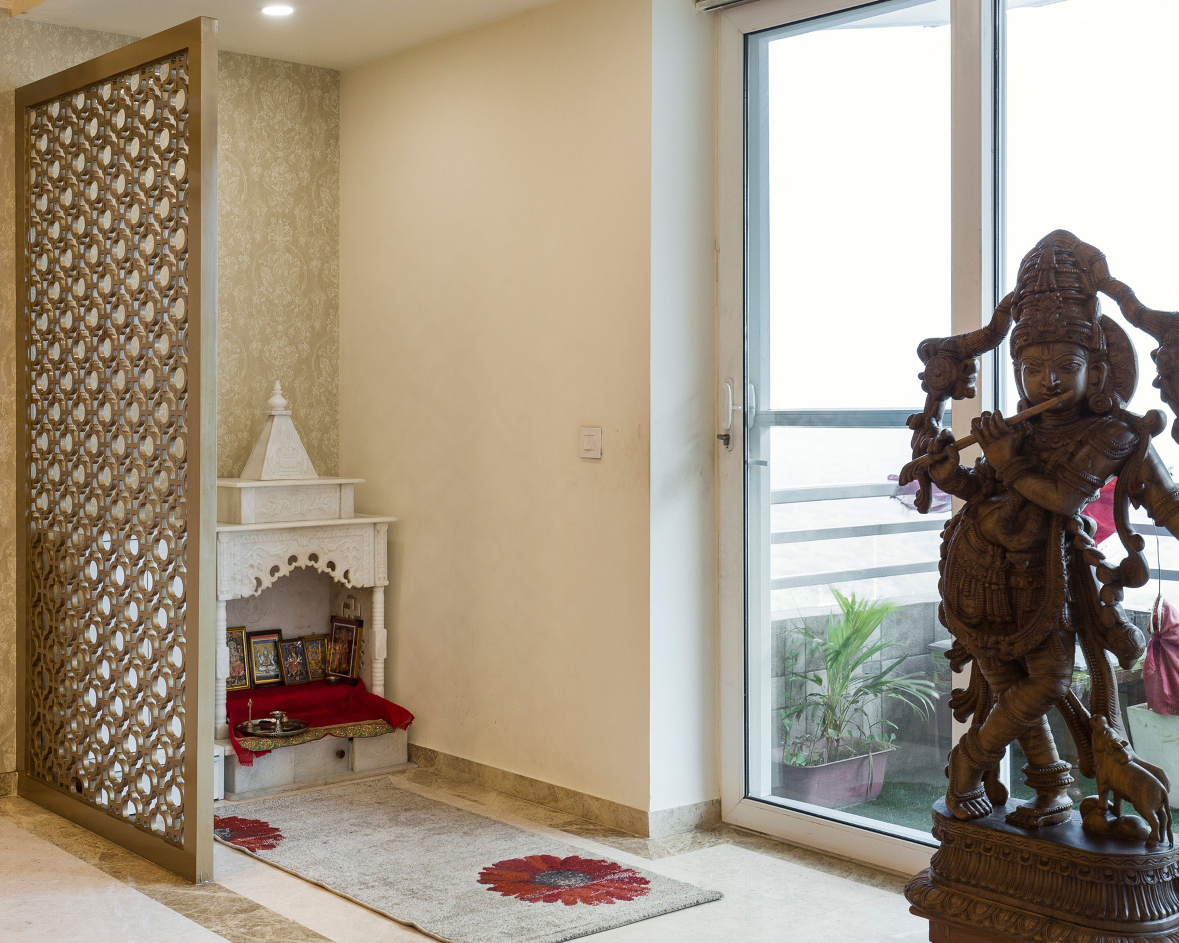 White Floor-Mounted Pooja Room Design With Wooden CNC-cut partition