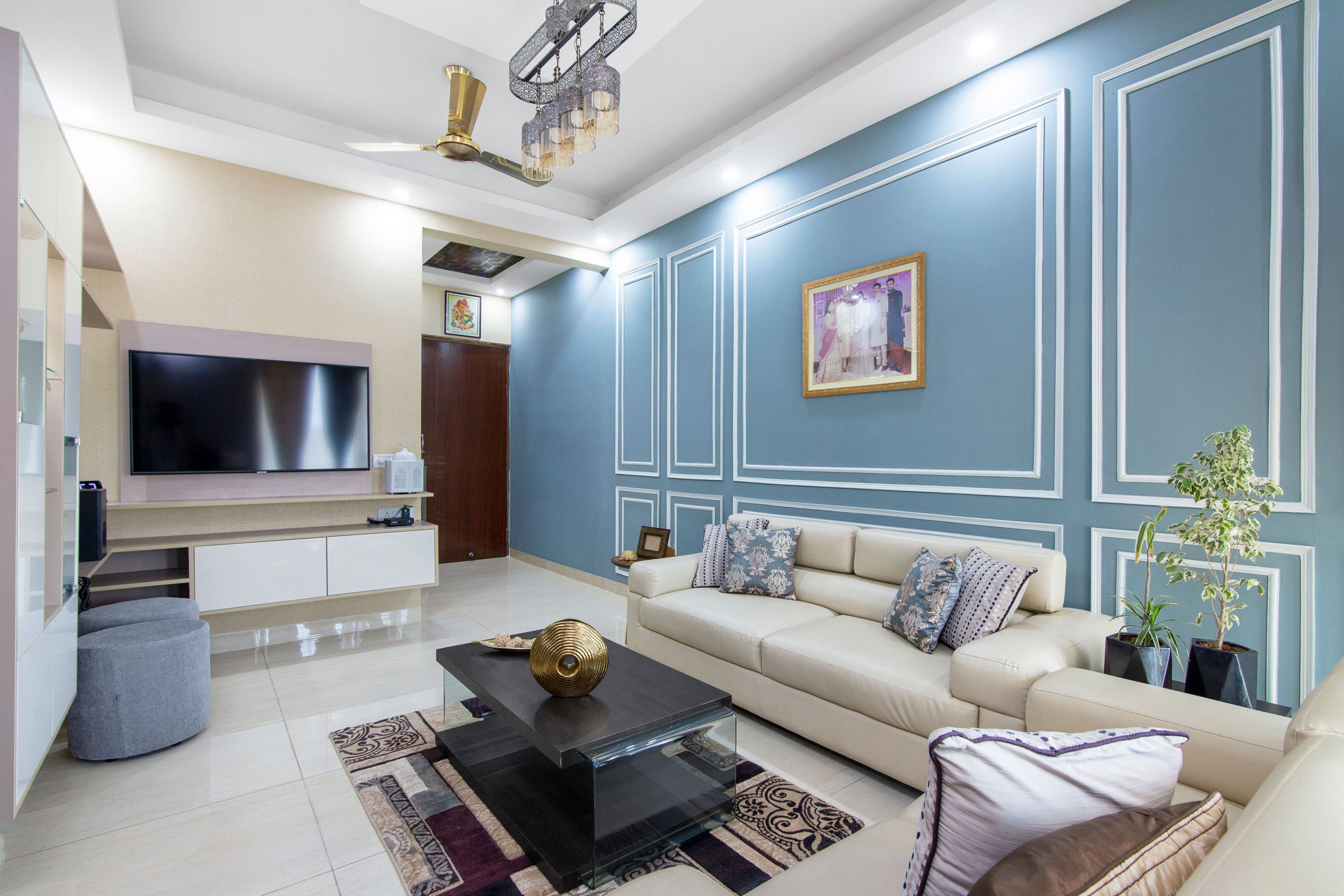 Blue And White Living Room With White And Wood Wall-Mounted TV Unit - Livspace