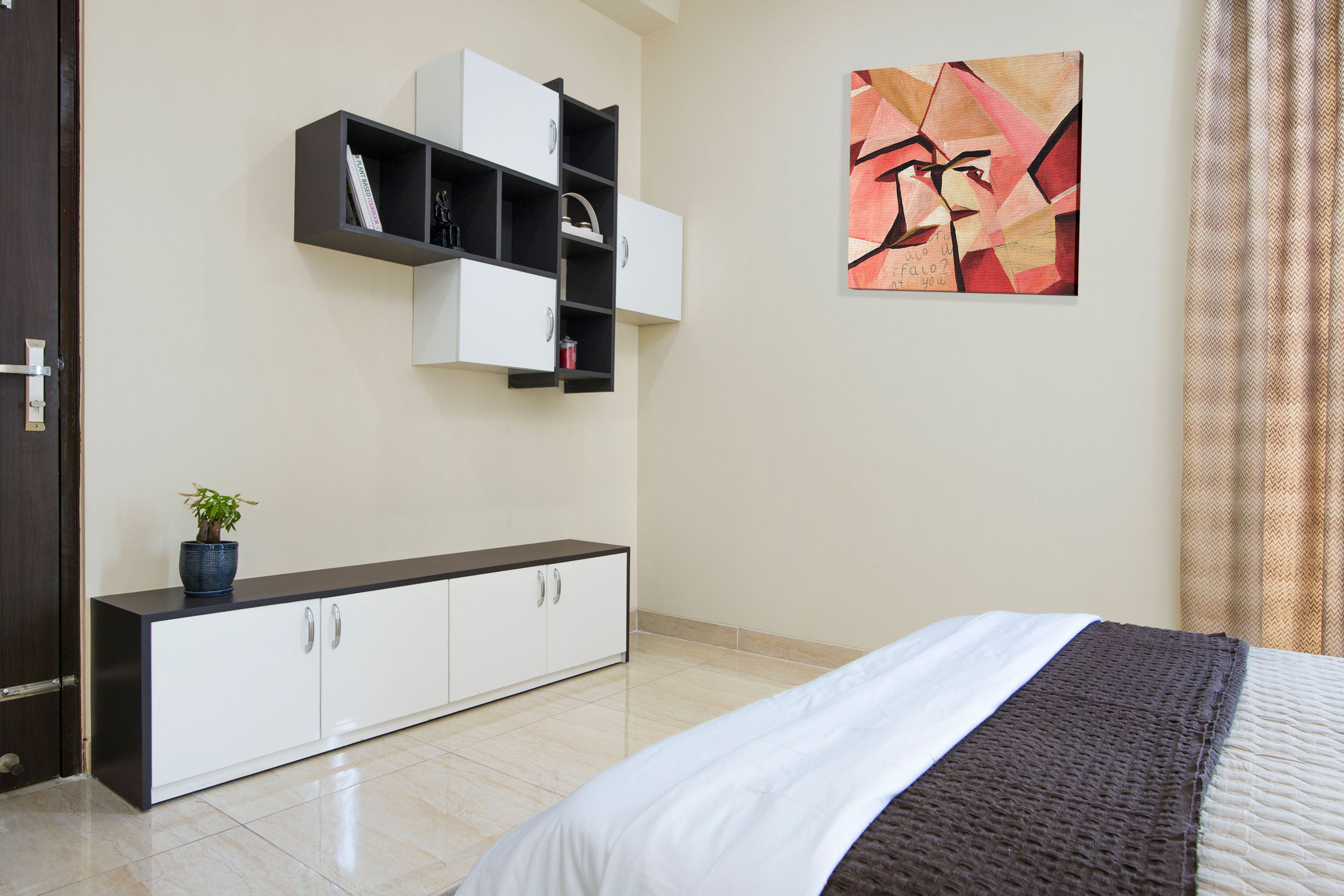 Floor-Mounted Black And White Storage Unit With Wall-Mounted Closed And Open Storage - Livspace