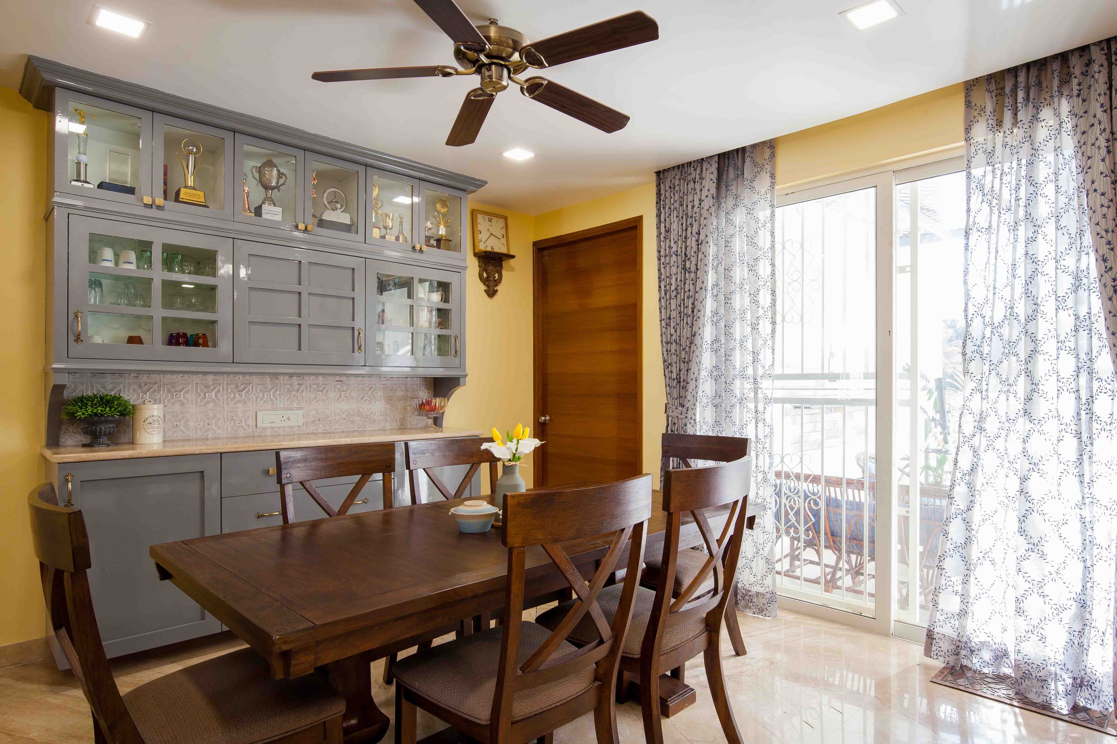 6-Seater Wooden Dining Room Design With Grey Storage Unit - Livspace