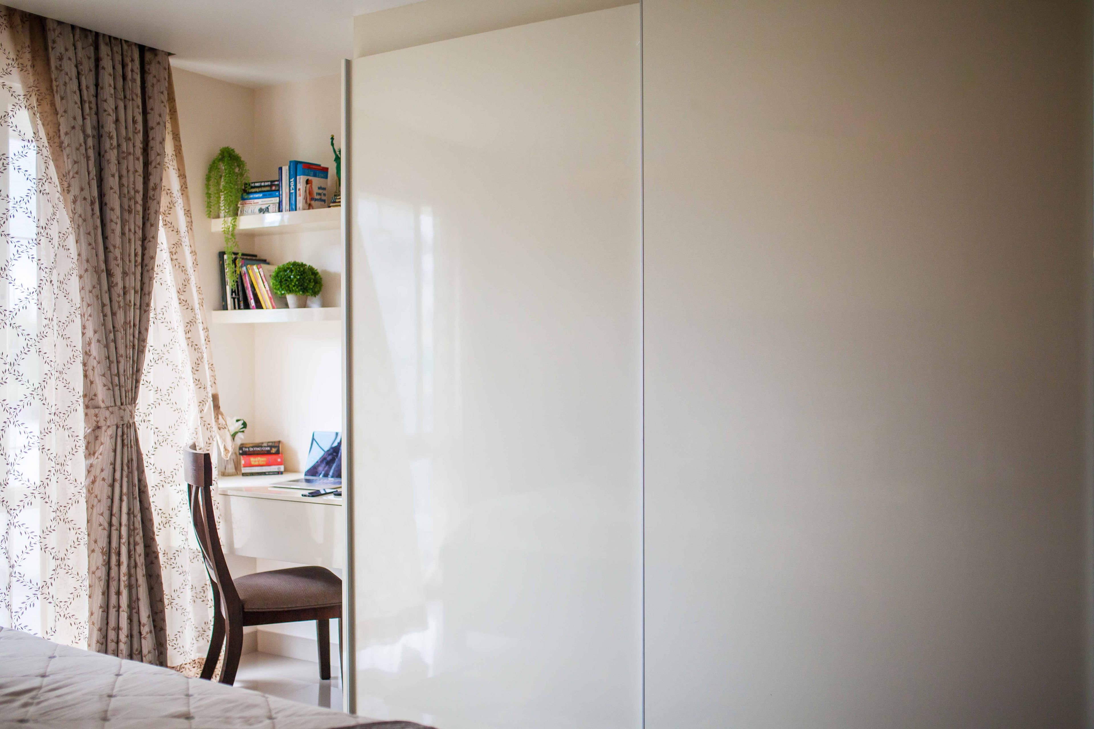 2-Door Off-White Sliding Wardrobe With Glossy Finish And Integrated Study Table - Livspace