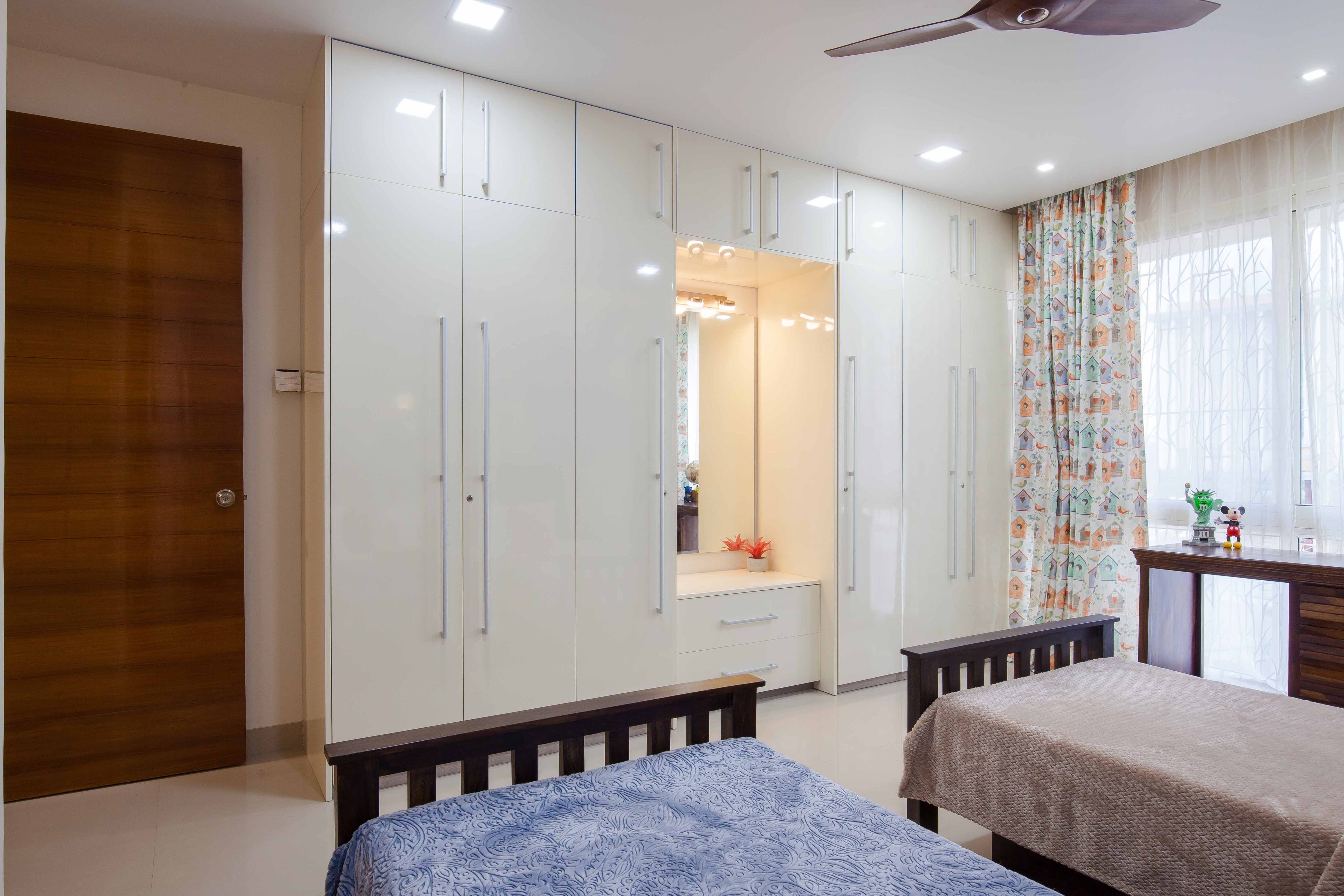 6-Door White Swing Wardrobe Design For Kids Room With Glossy Finish - Livspace