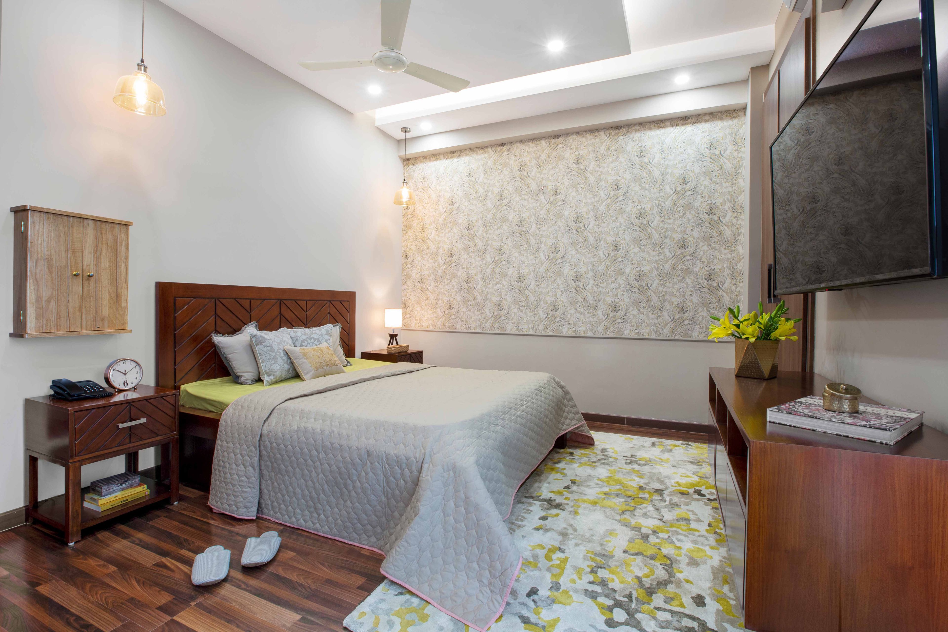 Master Bedroom Design With Wooden Bed, Flooring And Large Floor-Mounted TV Console - Livspace