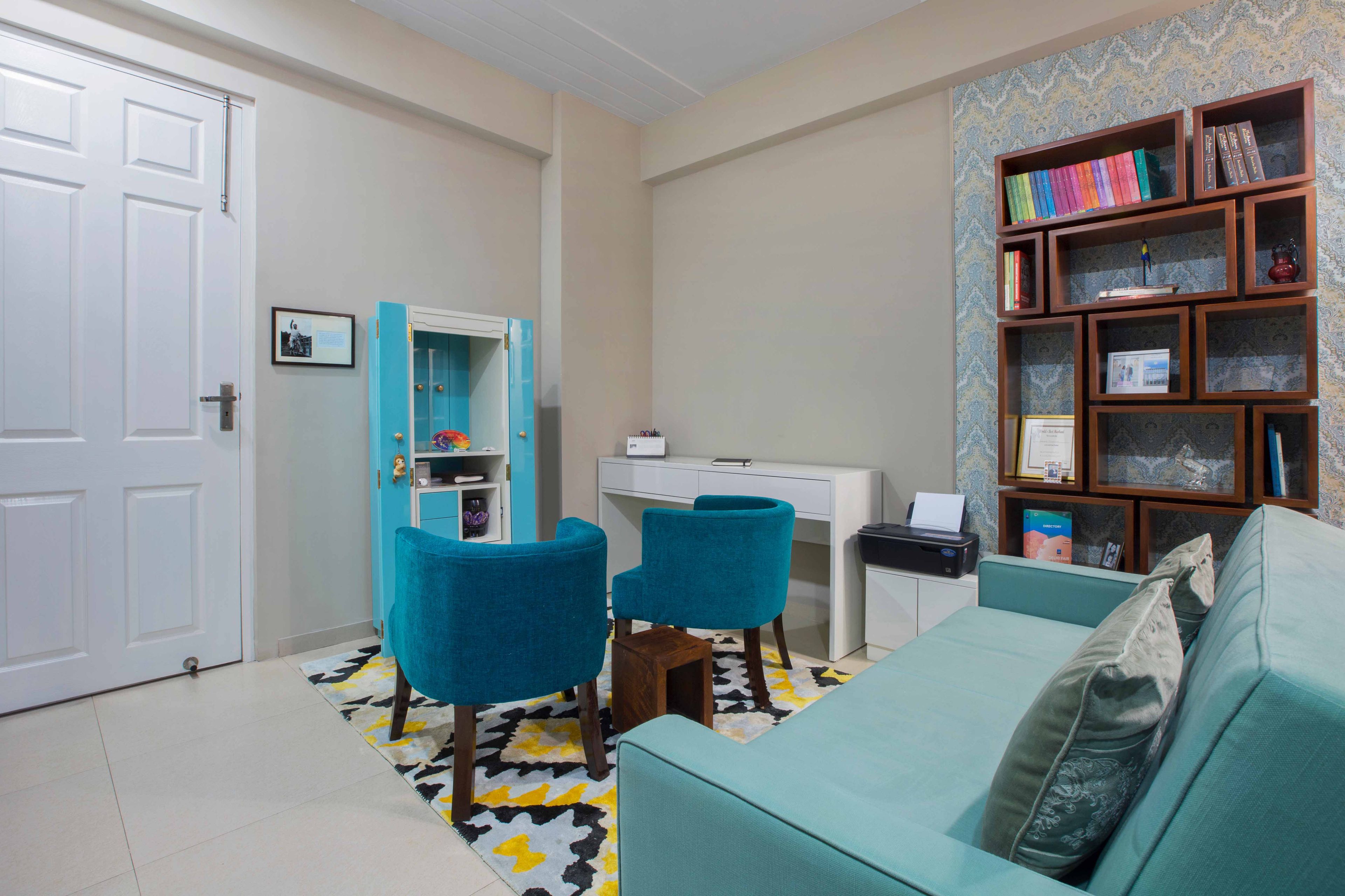 Blue Home Office Design With Wall Mounted Boxed Open Shelves - Livspace