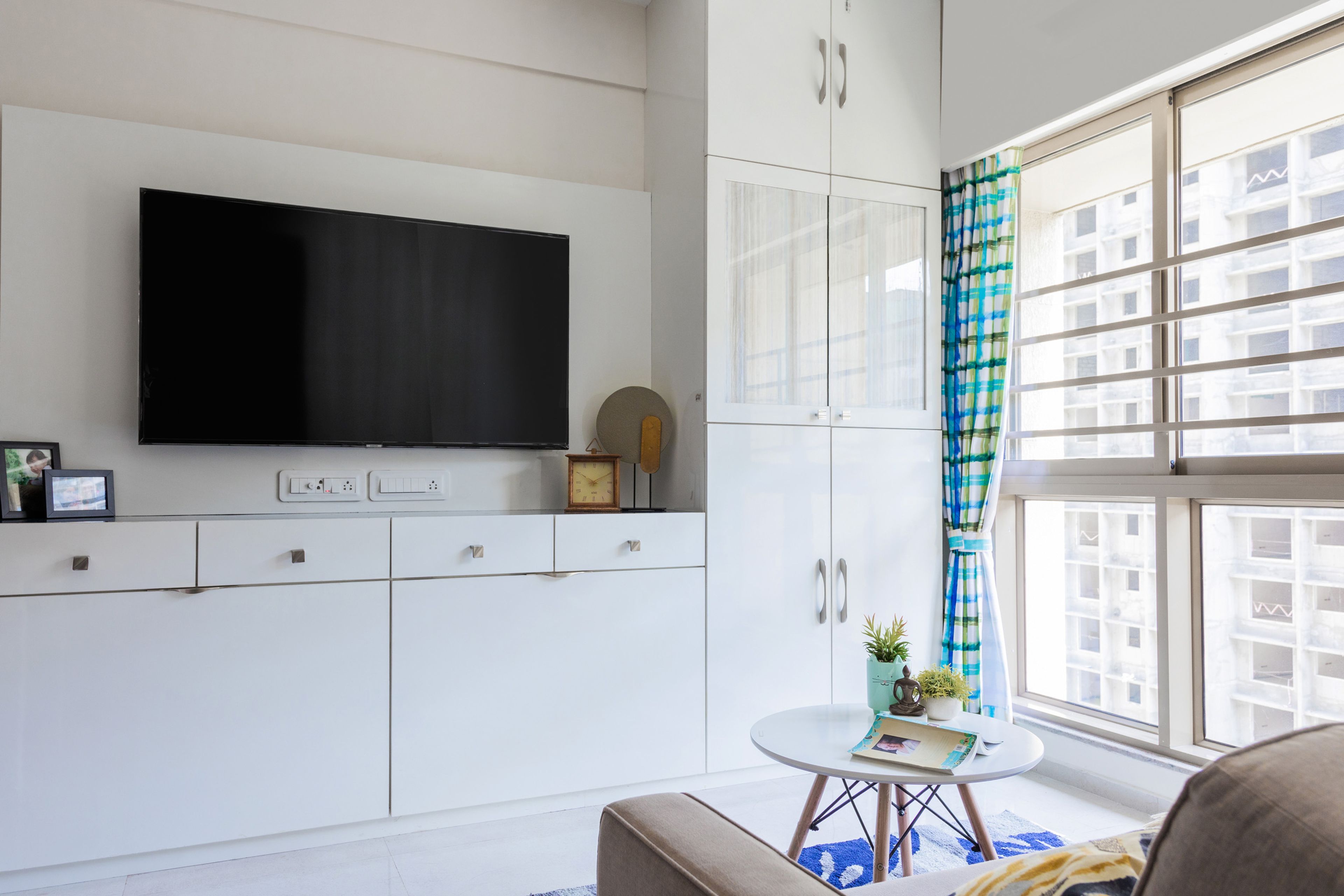 White TV Cabinet With Shutter Storage - Livspace