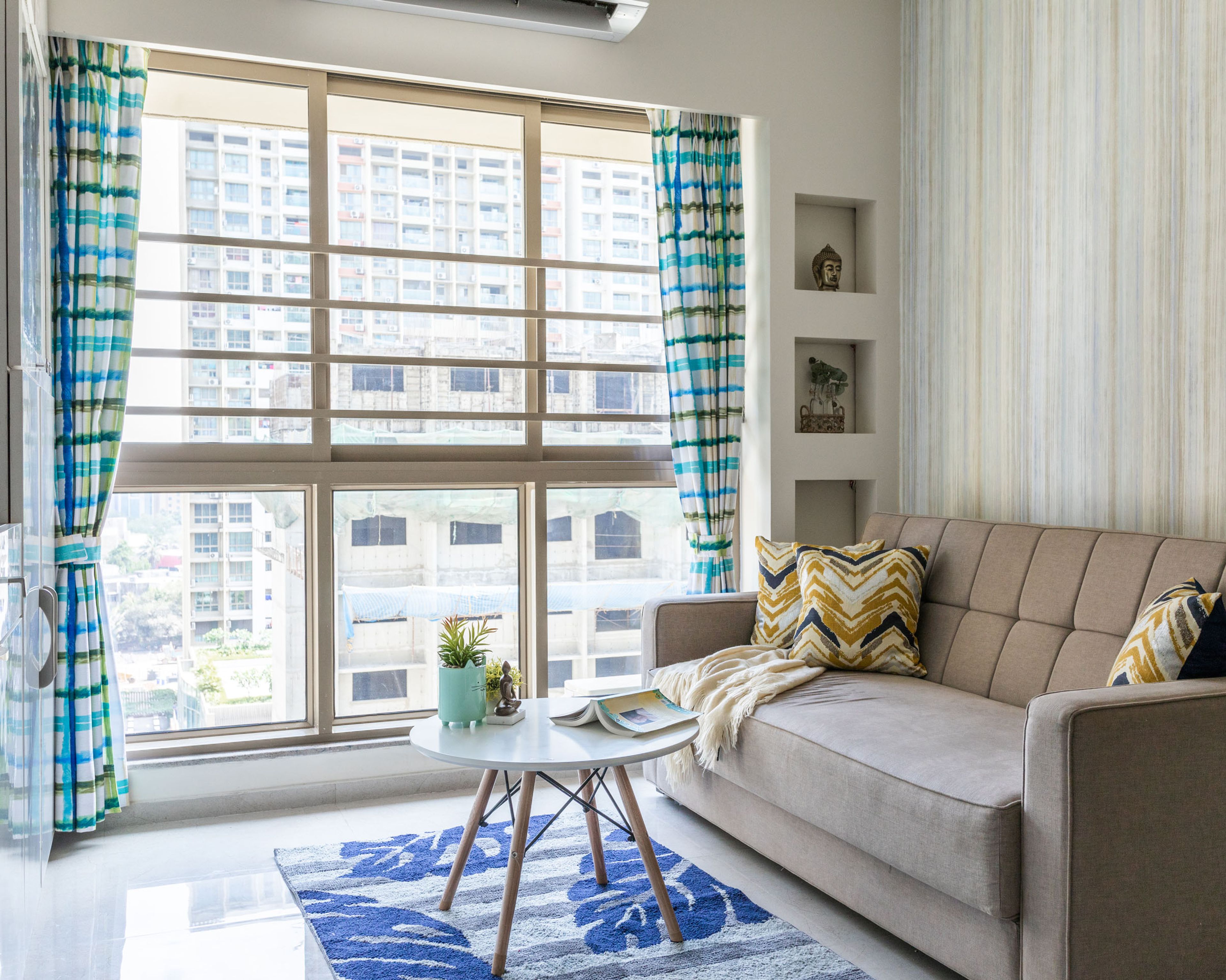 Compact Living Room With Beige Sofa - Livspace