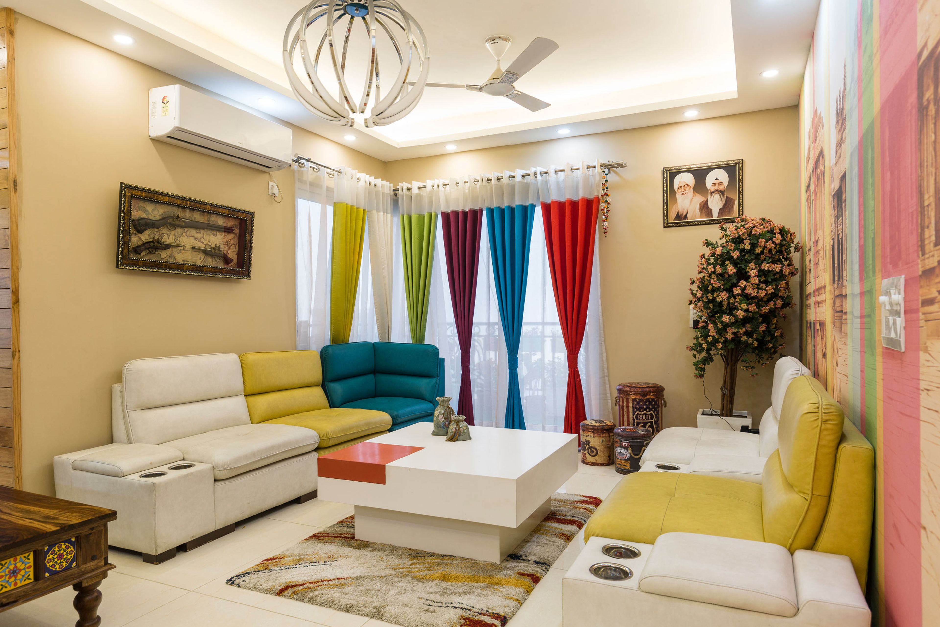 Multicoloured Living Room Design With Colourful Wallpaper And Beige Accent Wall - Livspace