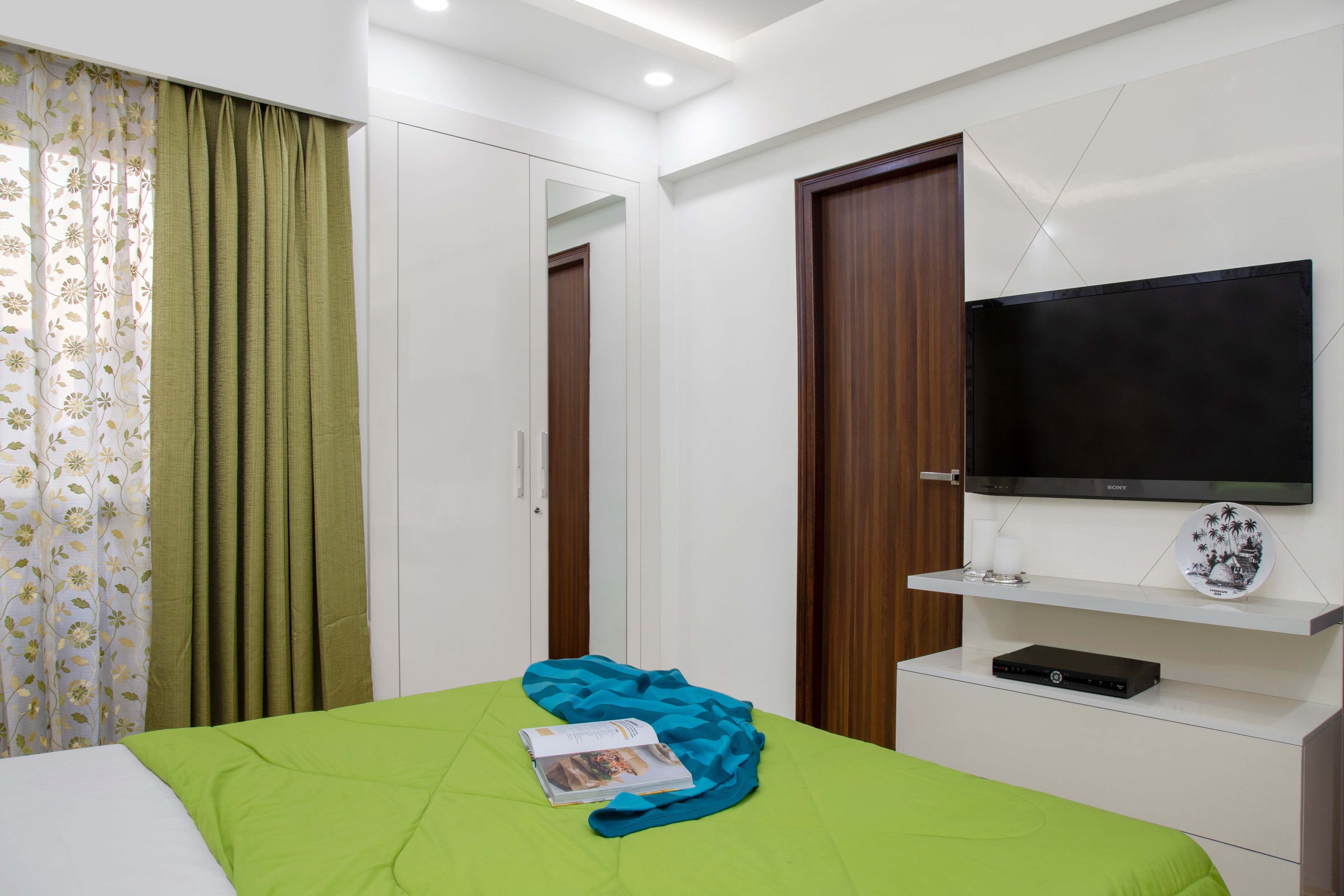 2-Door White, Mirrored Swing Wardrobe And White TV Unit For Master Bedroom - Livspace