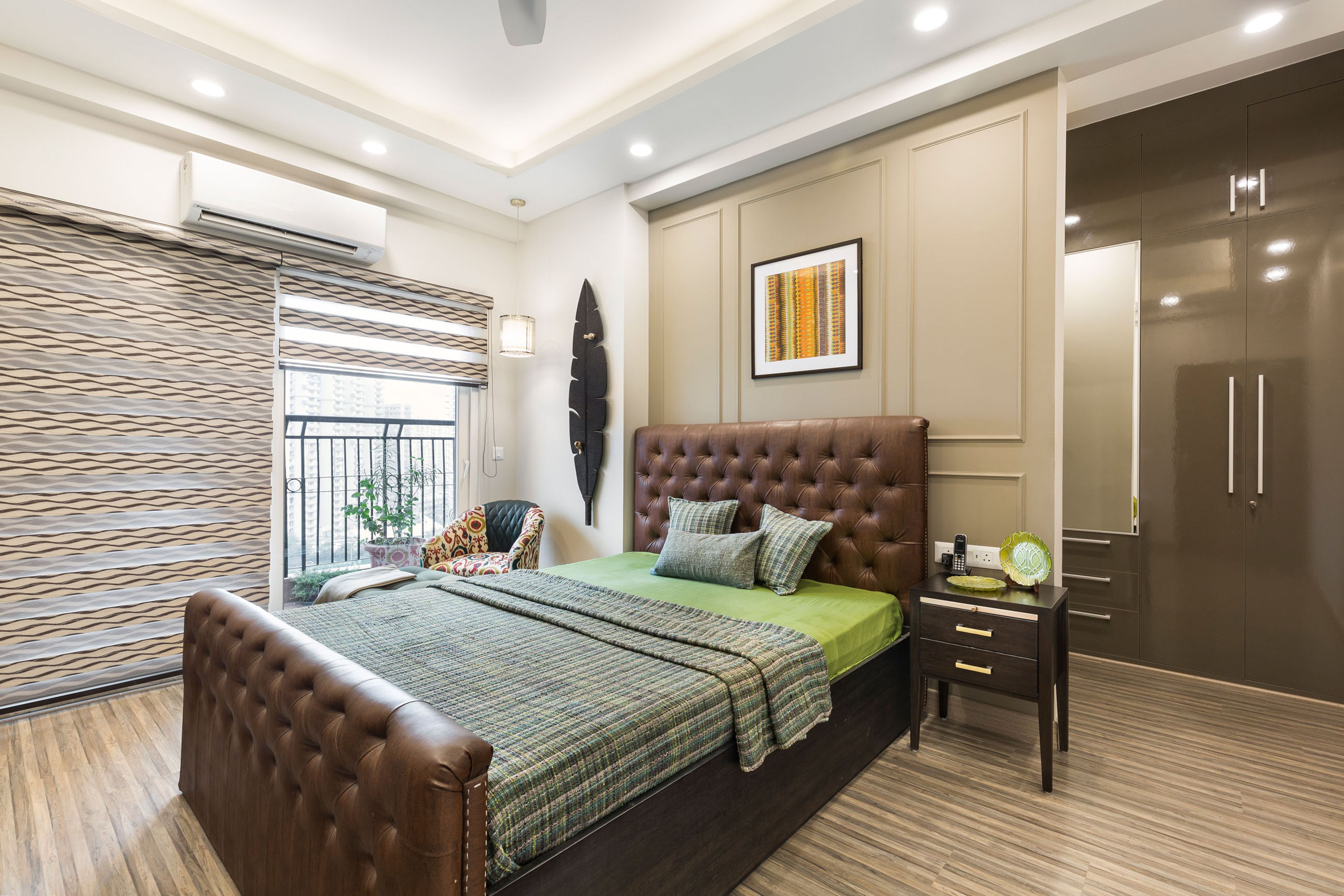 Guest Room Design With Queen-Size Bed And Brown Headboard, Brown Walk-In Wardrobe And Dark Beige Wall - Livspace
