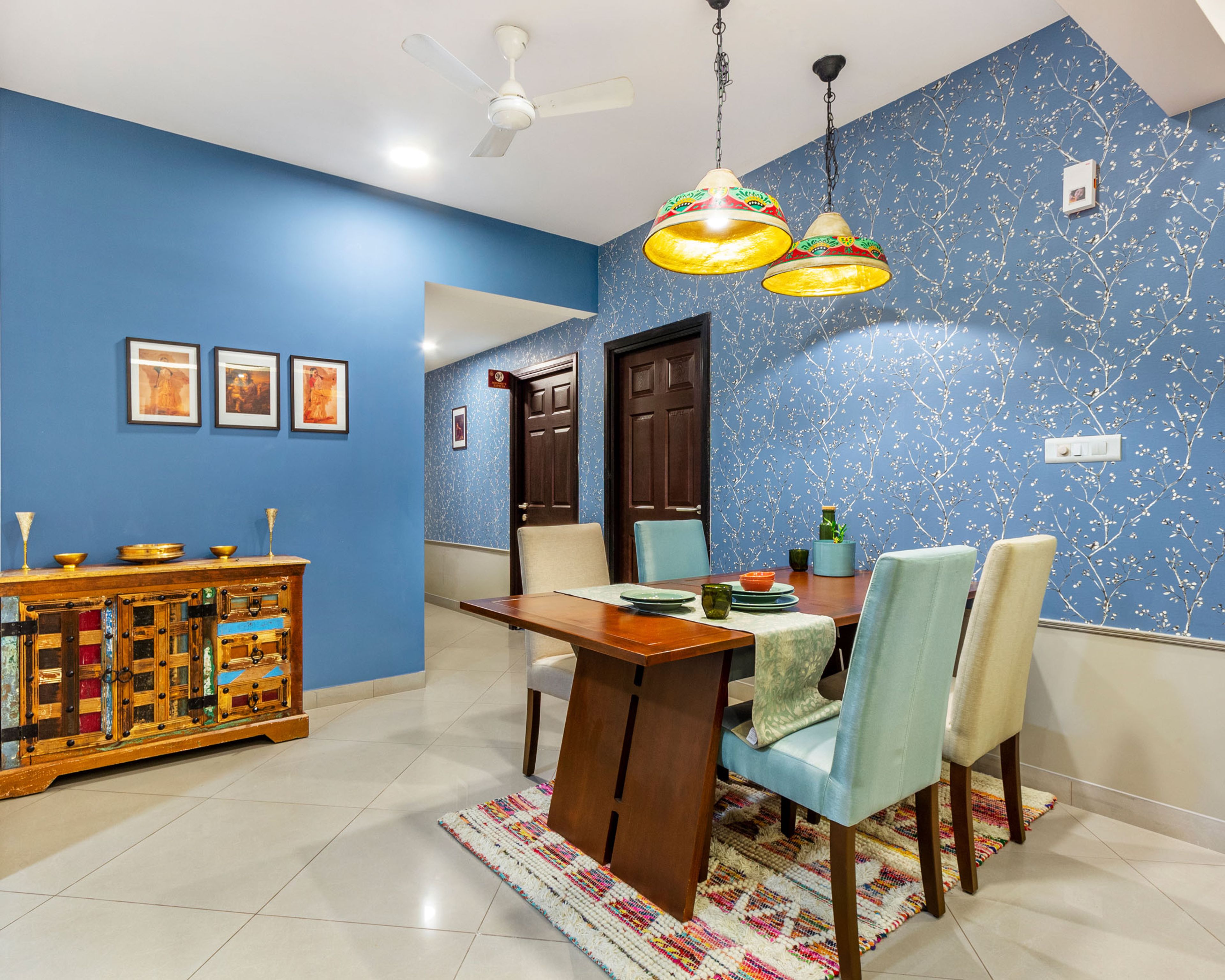 4-Seater Dining Room Design With Floral Blue Accent Wall - Livspace