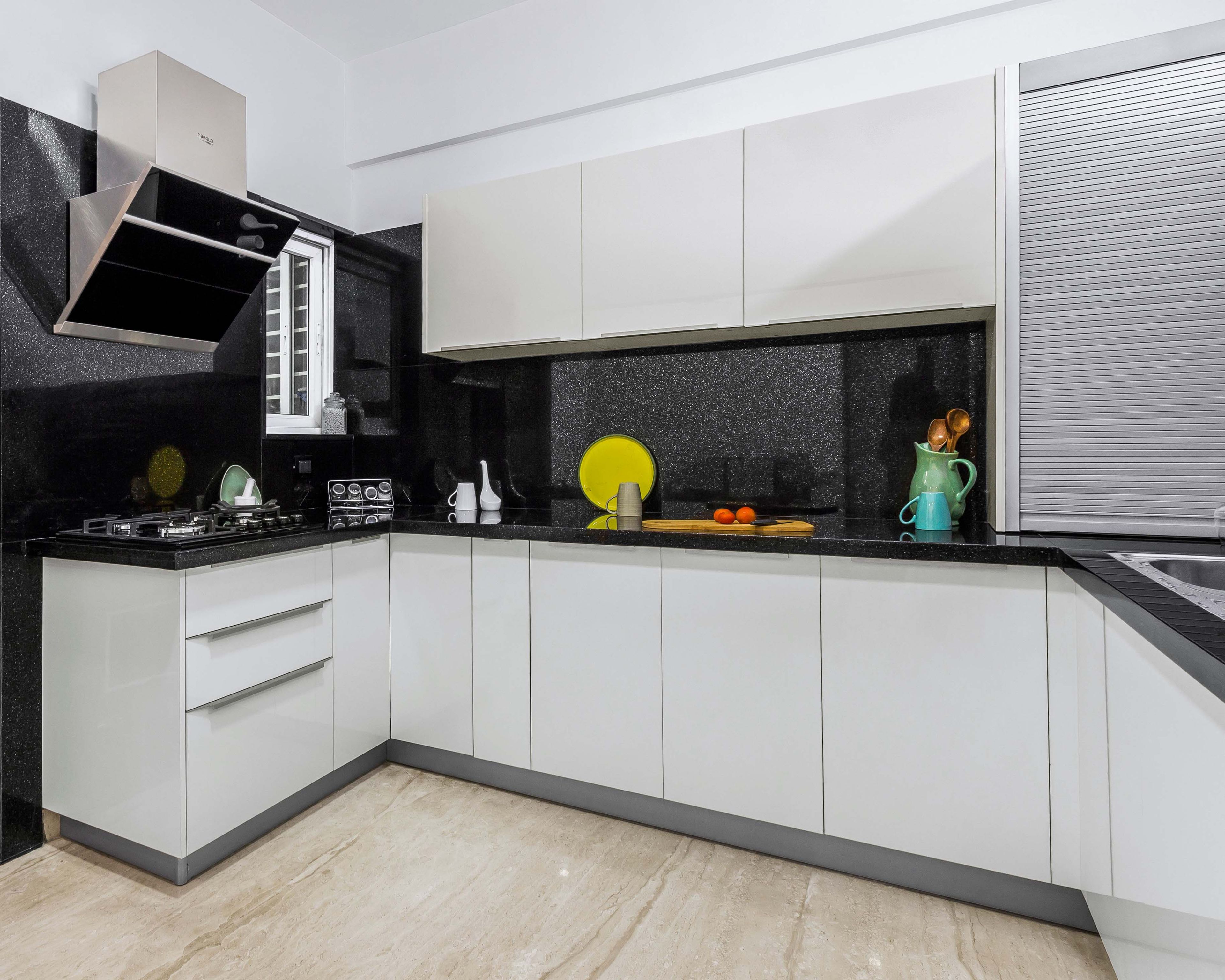 White Kitchen Cabinets With Black Galaxy Backsplash - Livspace