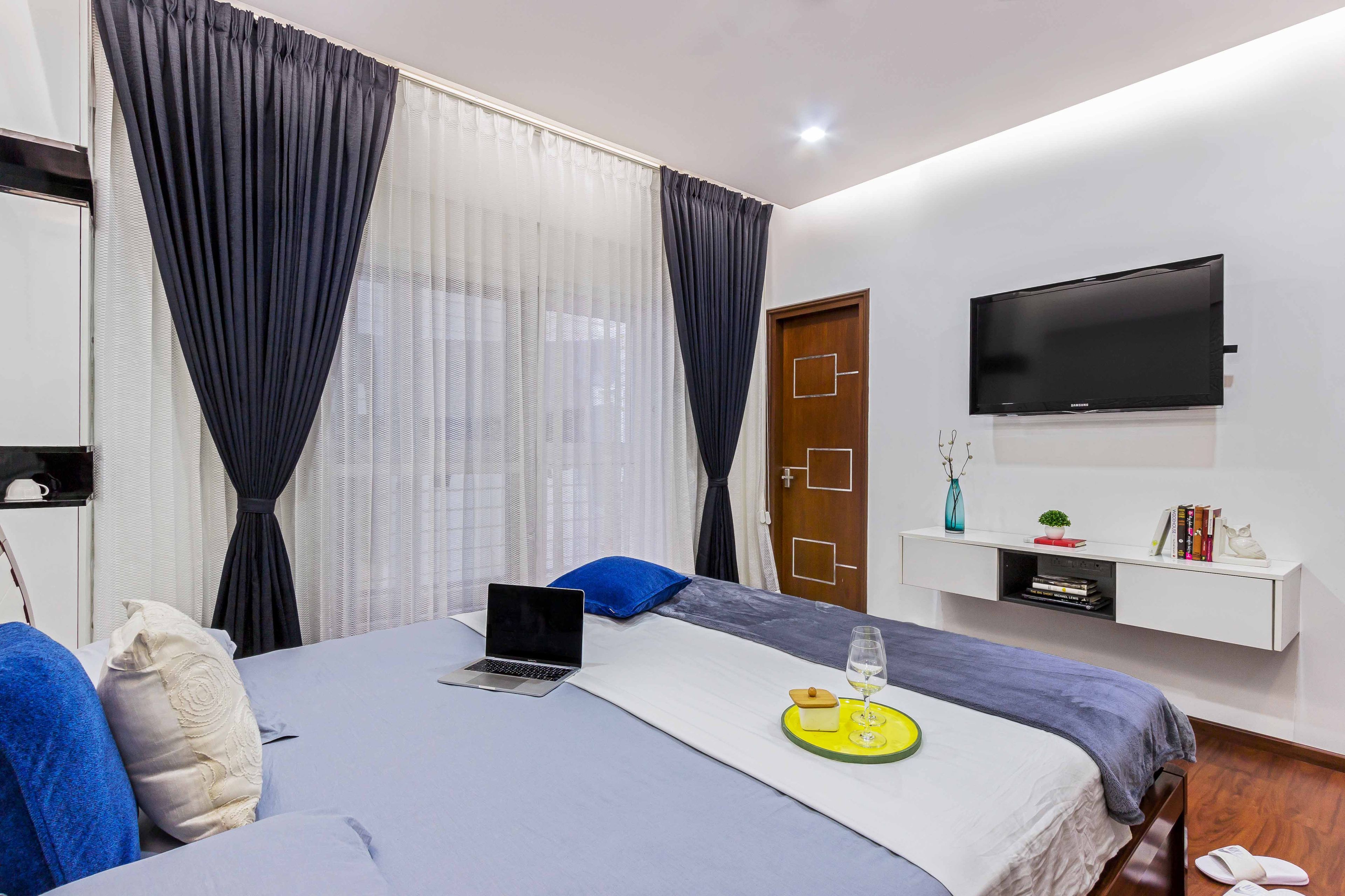 Master Bedroom White Floating TV Unit - Livspace