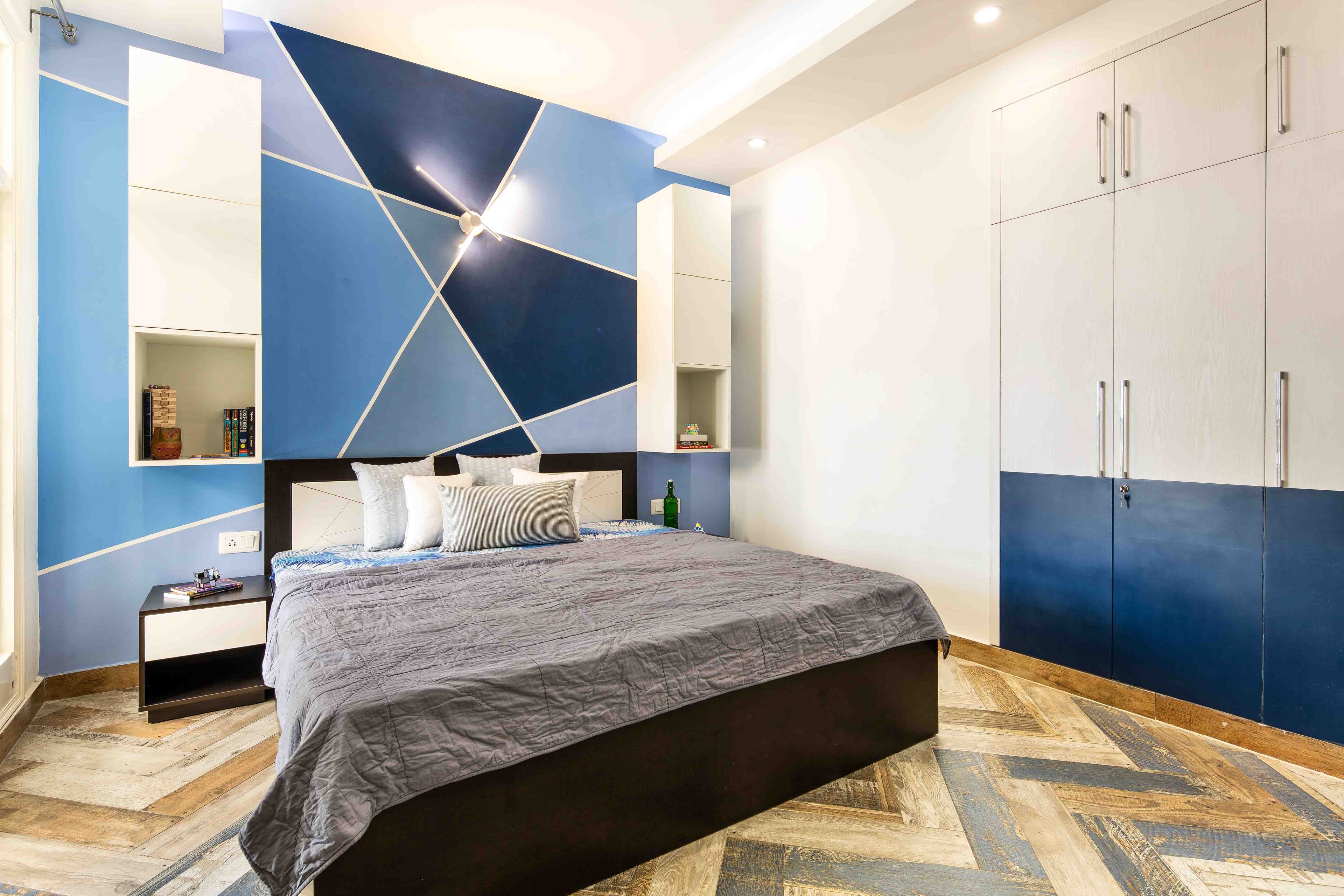 Blue Kids Bedroom Design With Abstract Wallpaper And Blue And White 3-Door Swing Wardrobe - Livspace