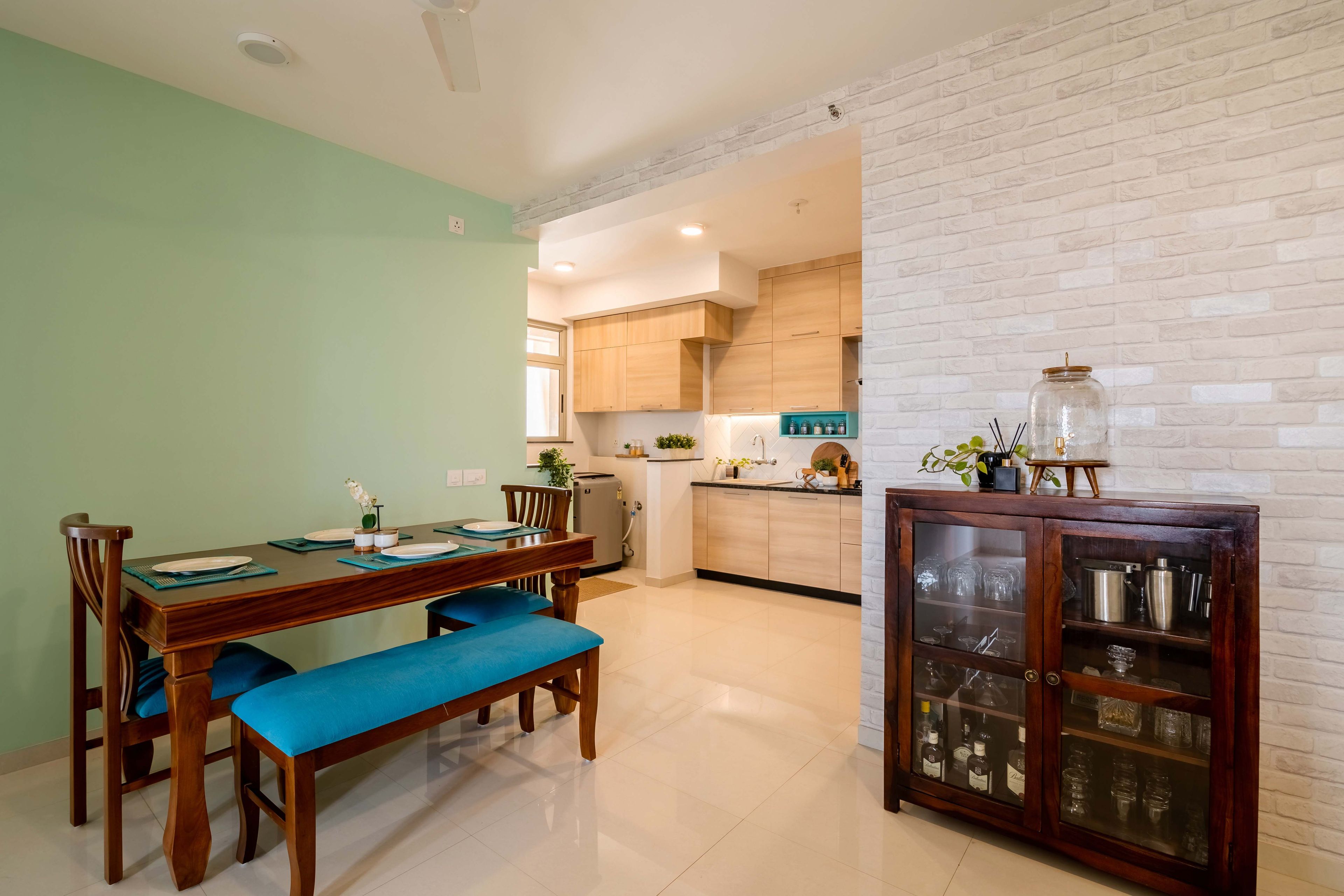 Dining Room With 2-Seater Wooden Table, Blue Bench And Wooden Storage Unit -Livspace
