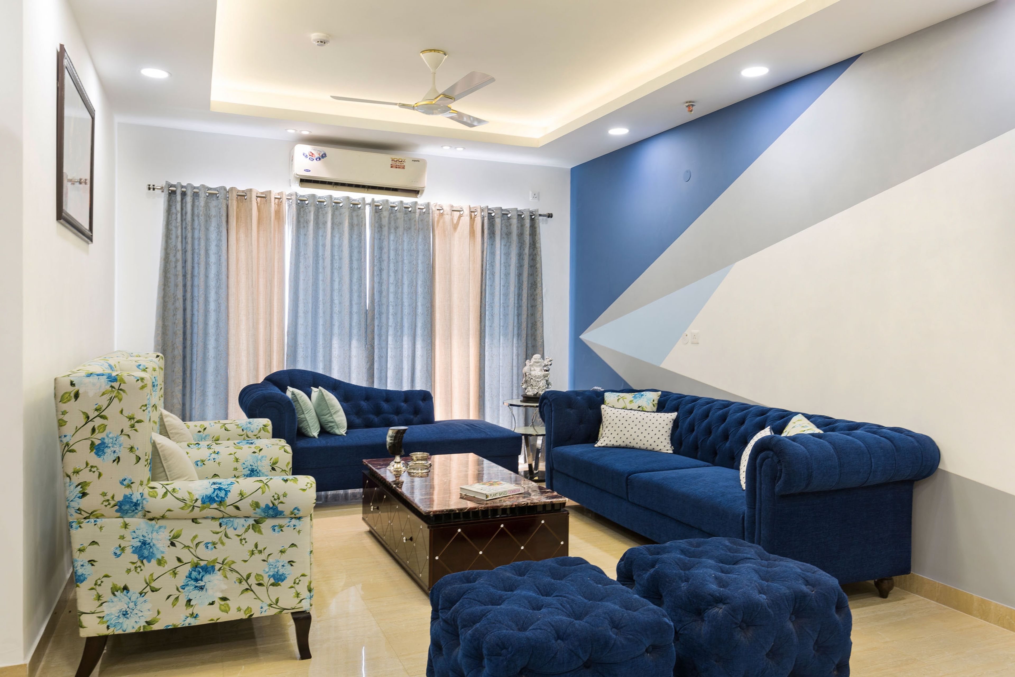 Contemporary Noida 2-BHK Flat Design With Wood-Panelled False Ceiling For Dining Room
