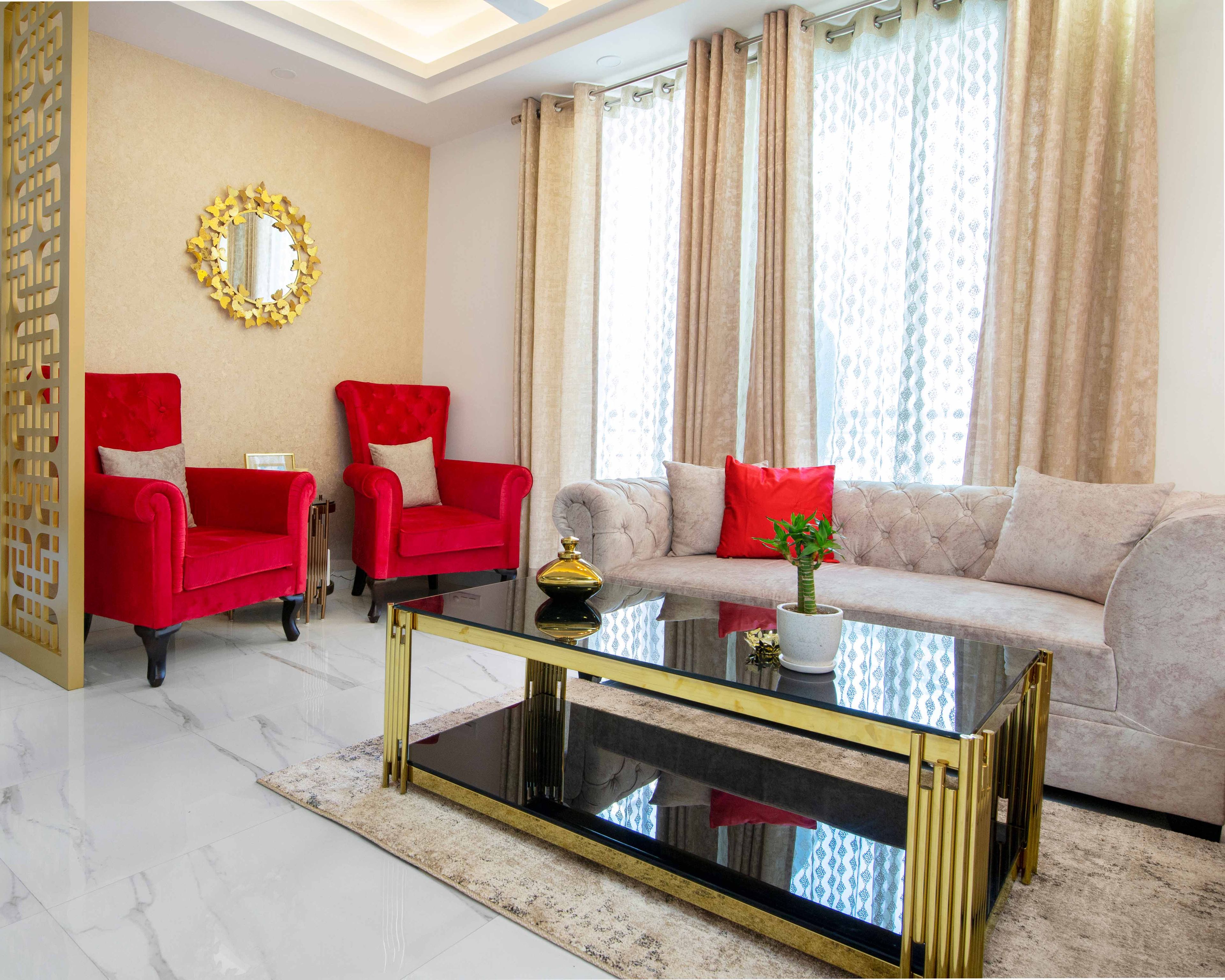 Beige Compact Living Room Design With Red Accent Chairs - Livspace