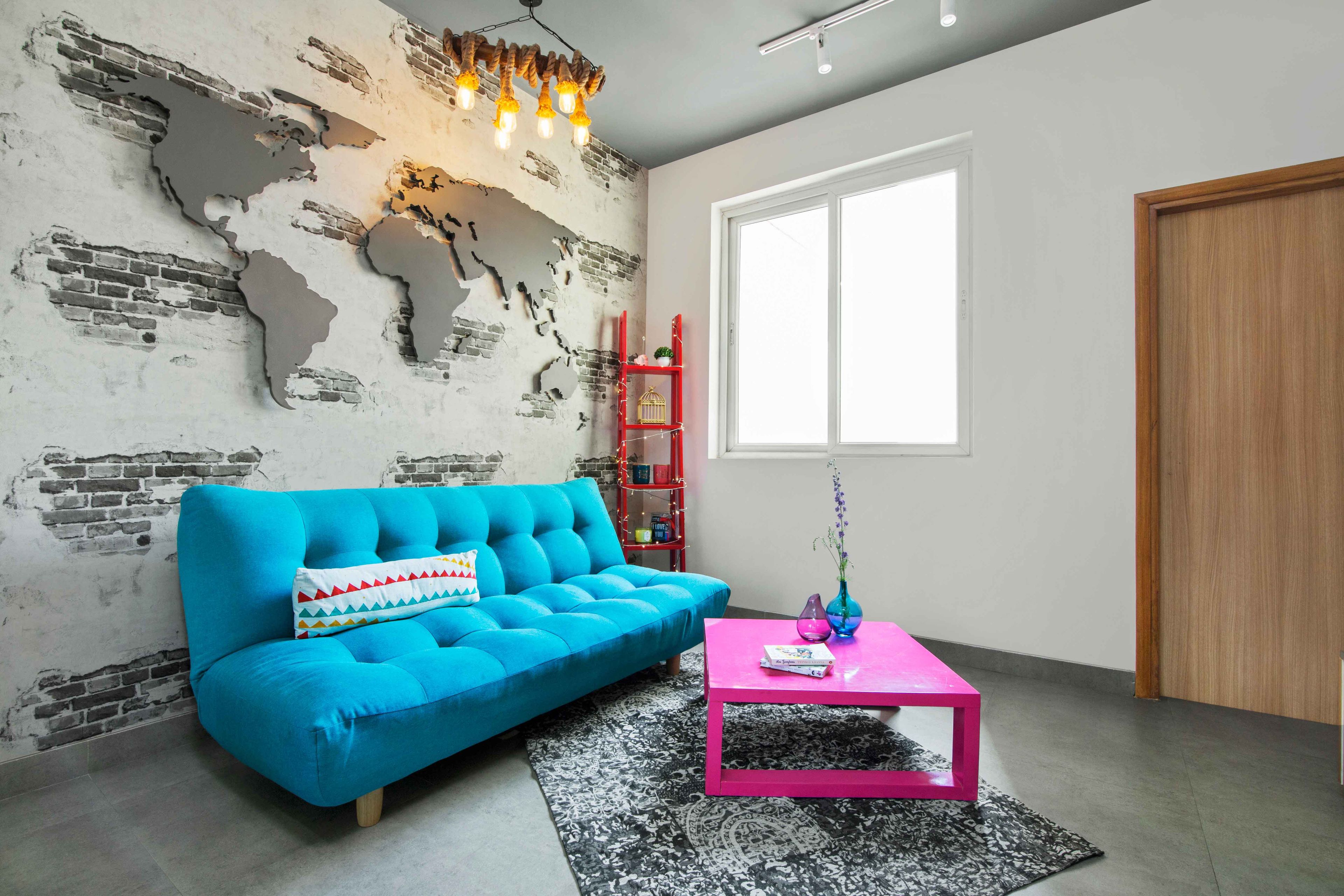 Family Room With Blue Sofa, 3D World Map Wall Design With Industrial Look And TV Unit - Livspace