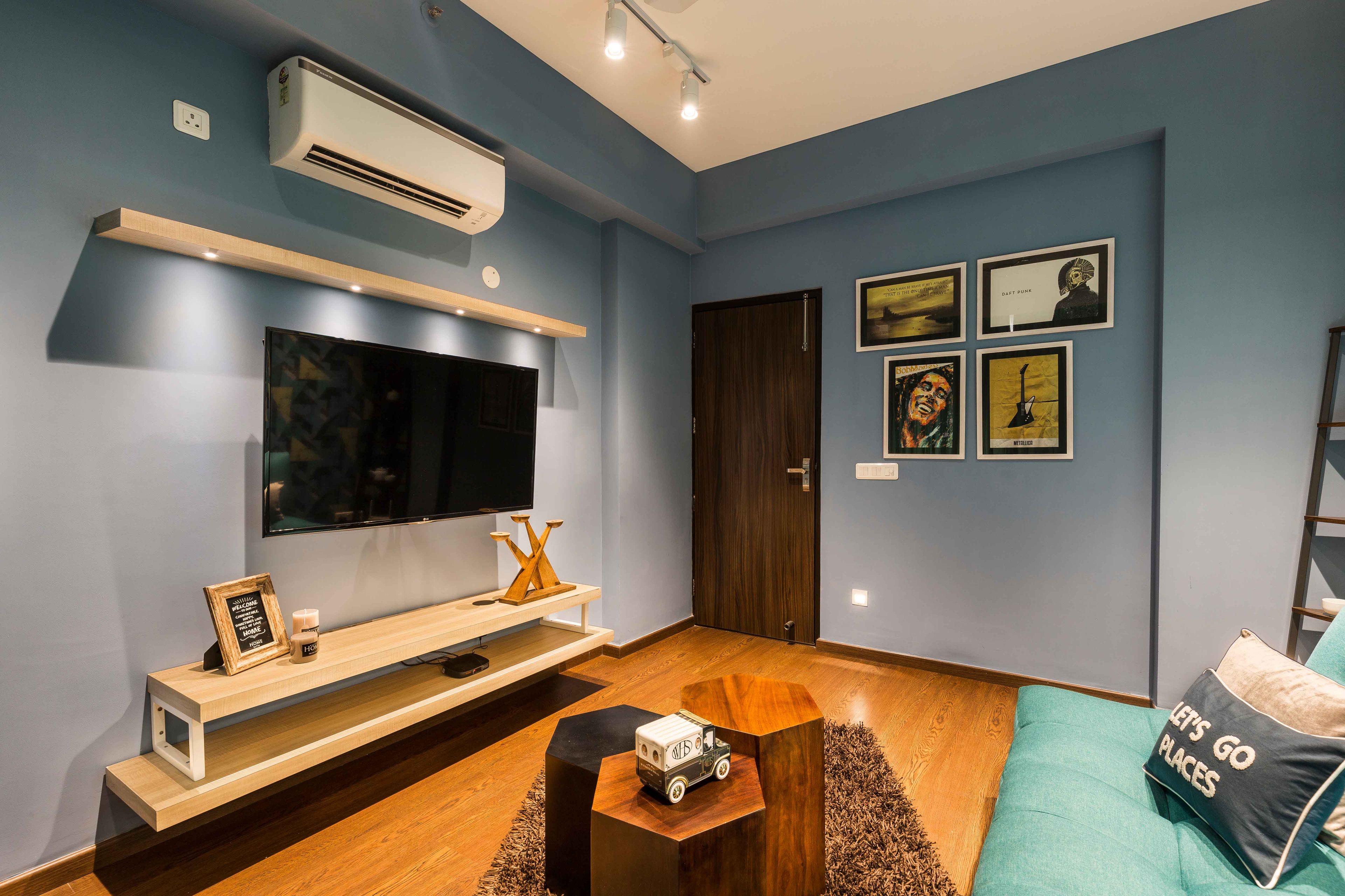 Home Theatre Design with Wooden TV Unit and Grey Walls - Livspace