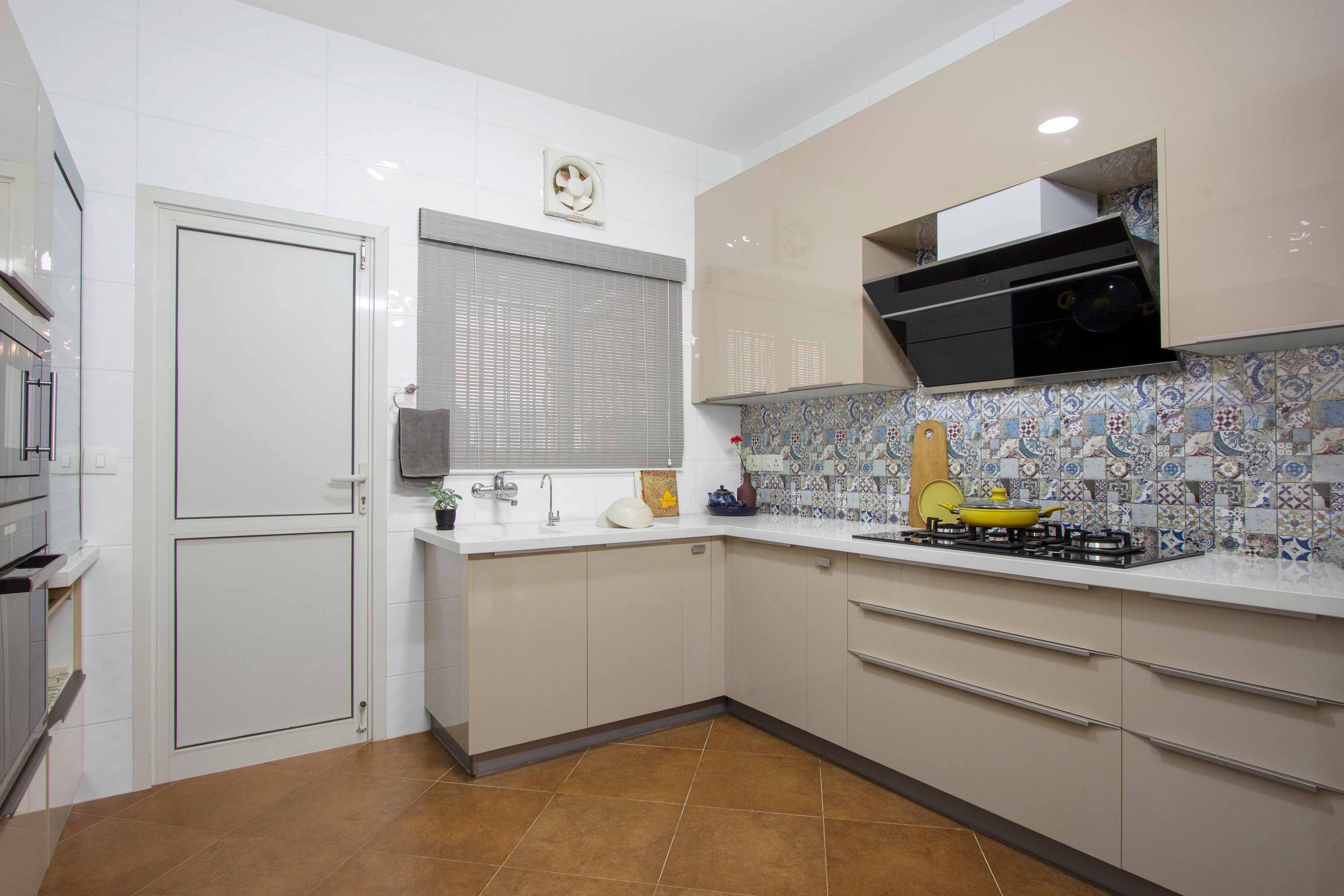 L-Shaped Beige and Wood Modular Kitchen and Moroccan Tiles - Livspace