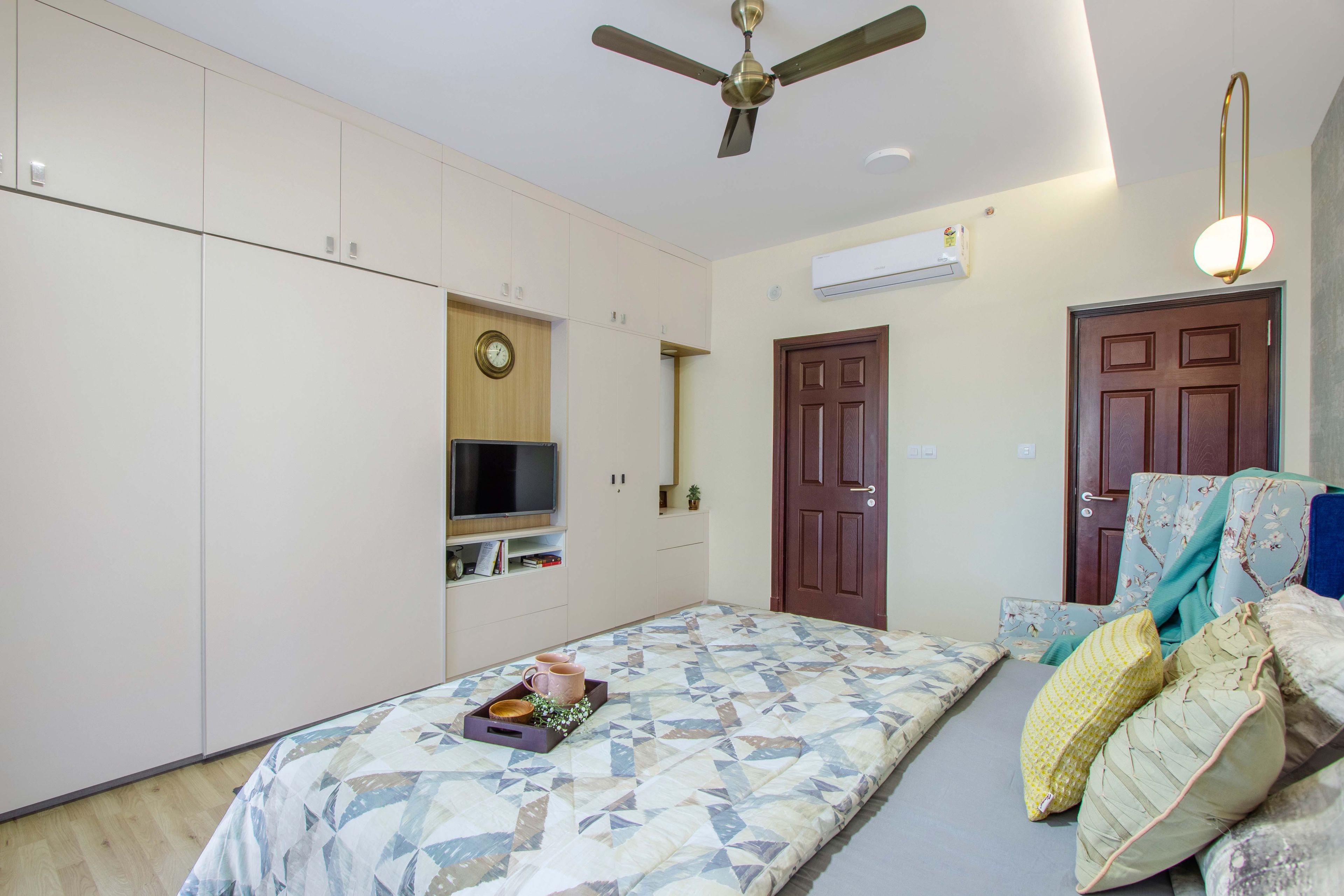 Master Bedroom Design with 2-Door Beige Sliding Wardrobe and TV Unit and Dresser - Livspace