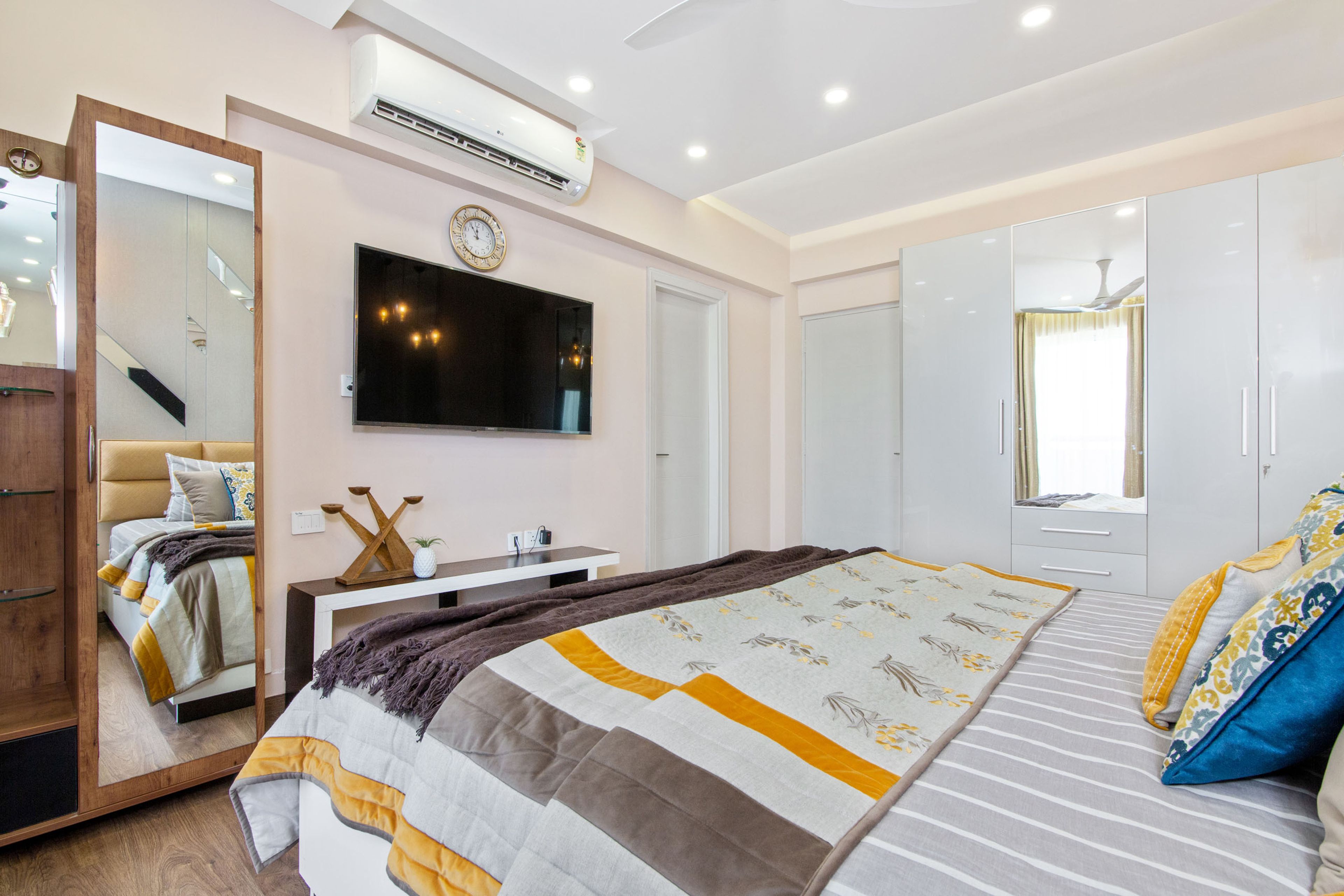 Contemporary 2 BHK Flat Design with Master Bedroom and Guest Bedroom with 4 Door Wardrobe