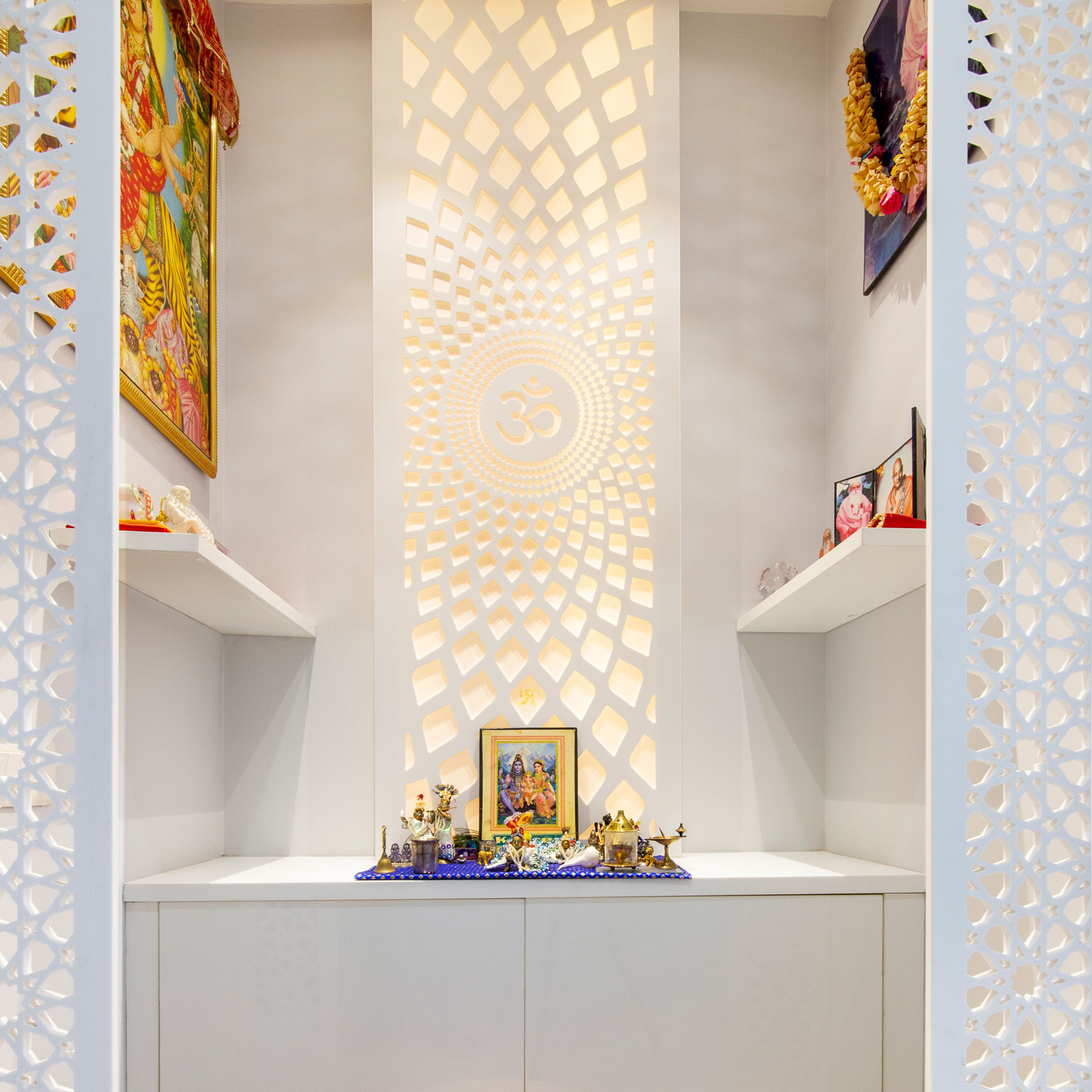 Open Pooja Unit Design with White Om Backsplash