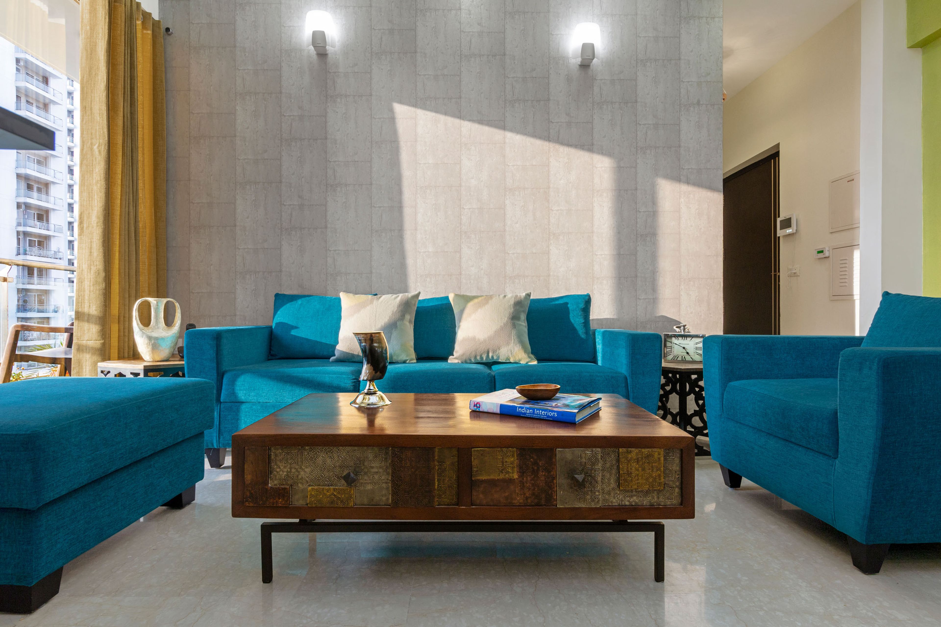 U-Shaped Spacious Living Room Design In Blue With Rectangular Coffee Table - Livspace