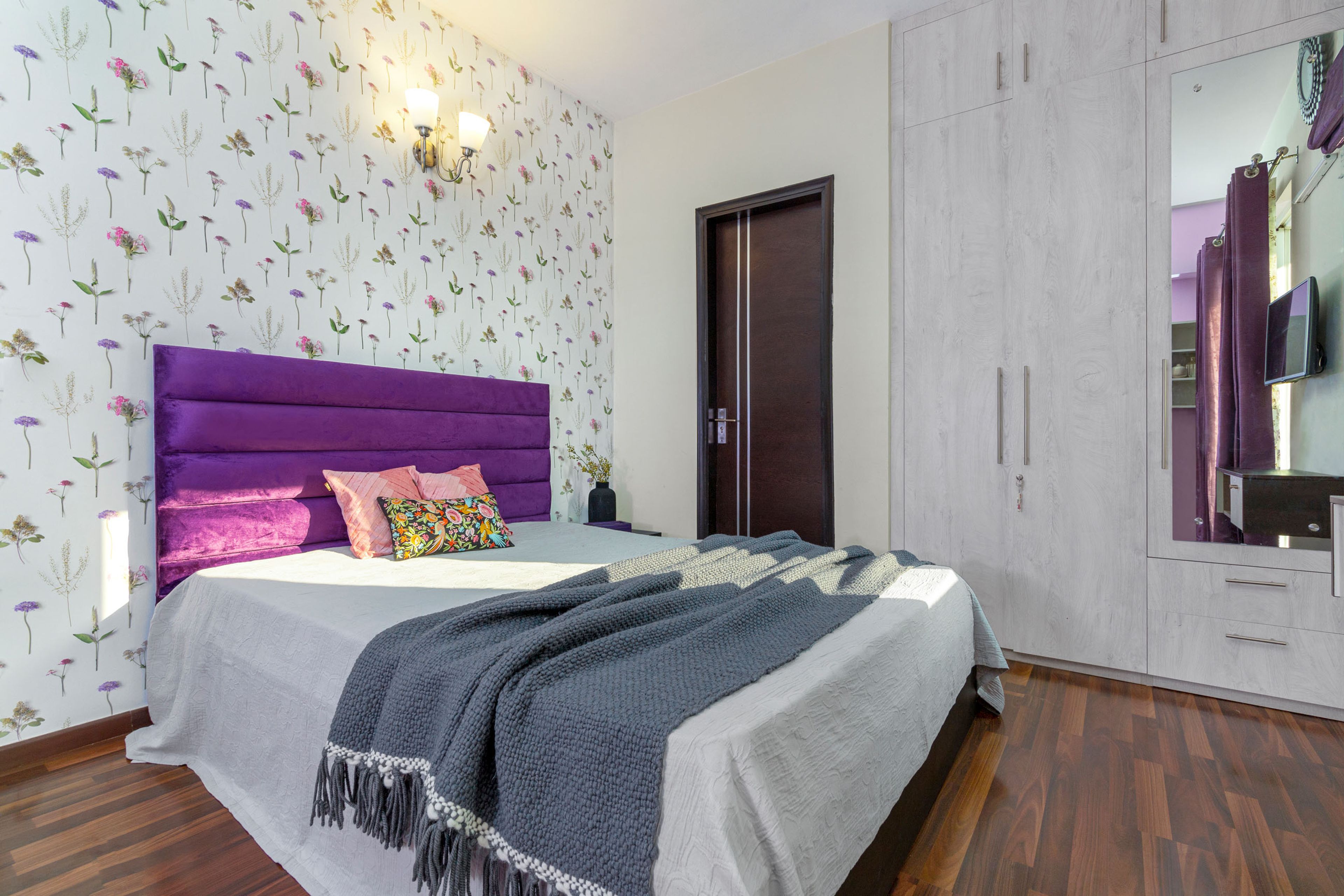 Contemporary 2-BHK Flat Design In Gurgaon With Spacious Living Room Design With U-Shaped Sofa Set