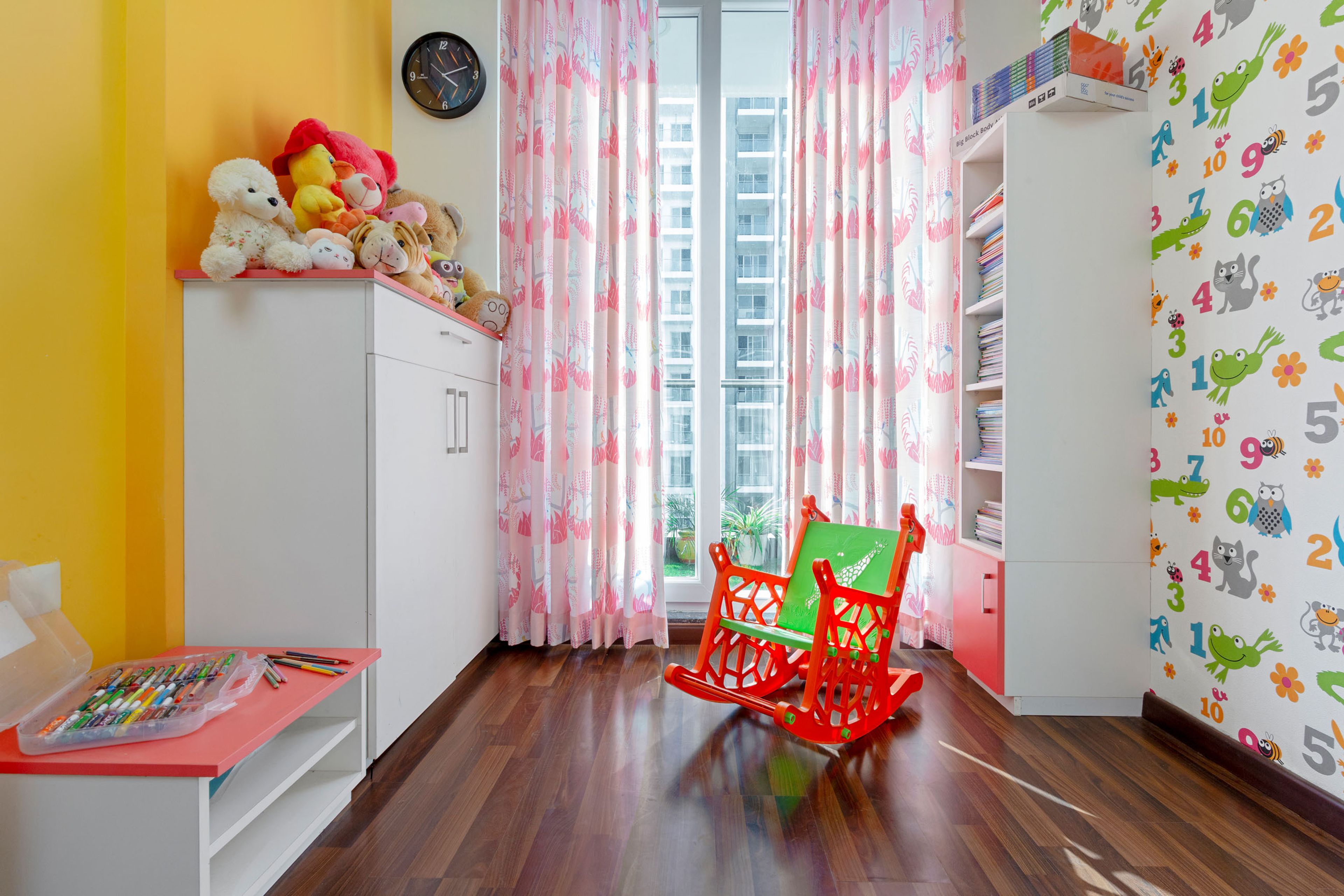 Compact Kids Room Design With Yellow Accent Wall And 2-Door White Swing Storage Unit - Livspace